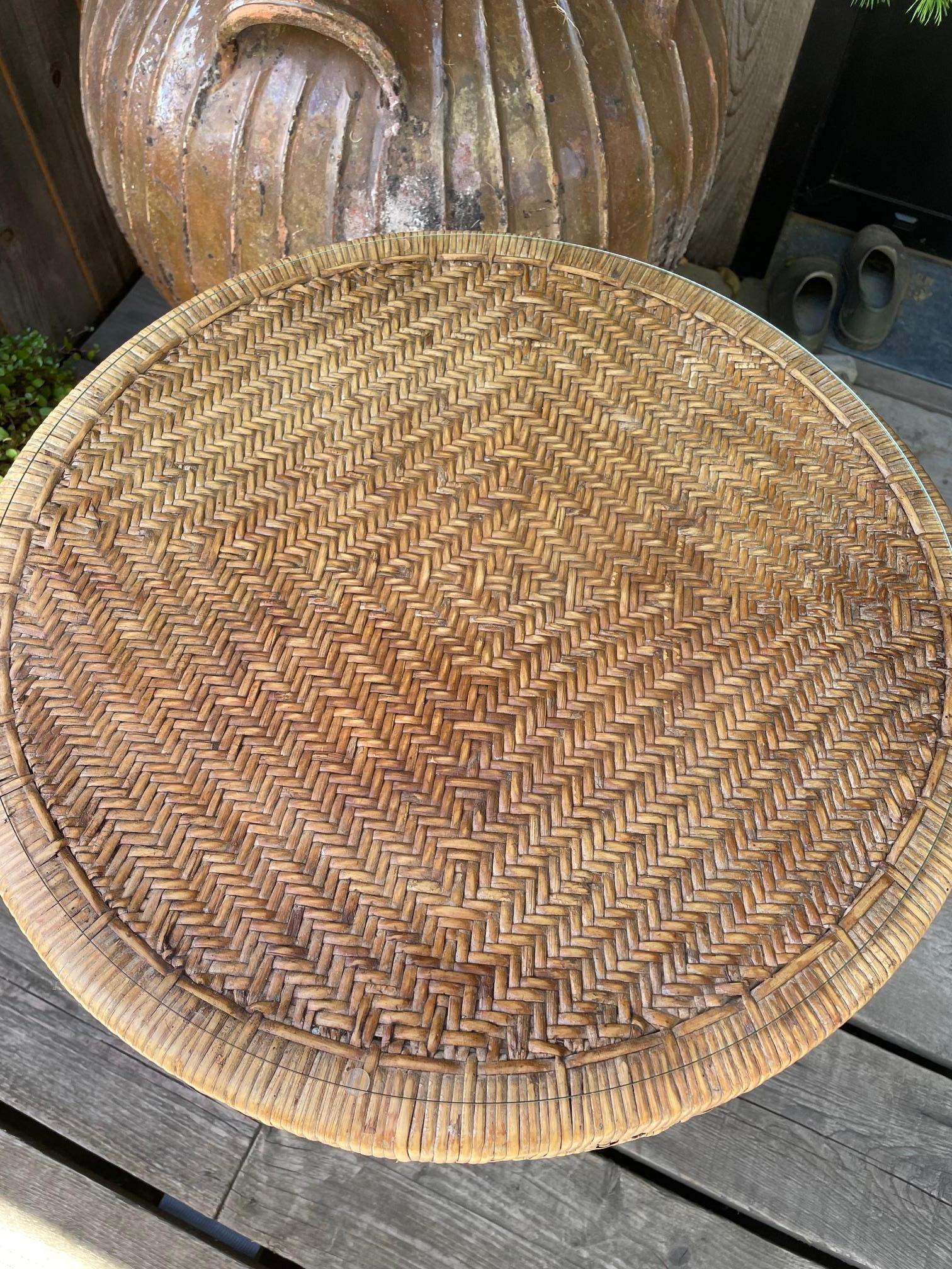 Small rattan table.
vintage with its glass top and brass feet, timeless.
