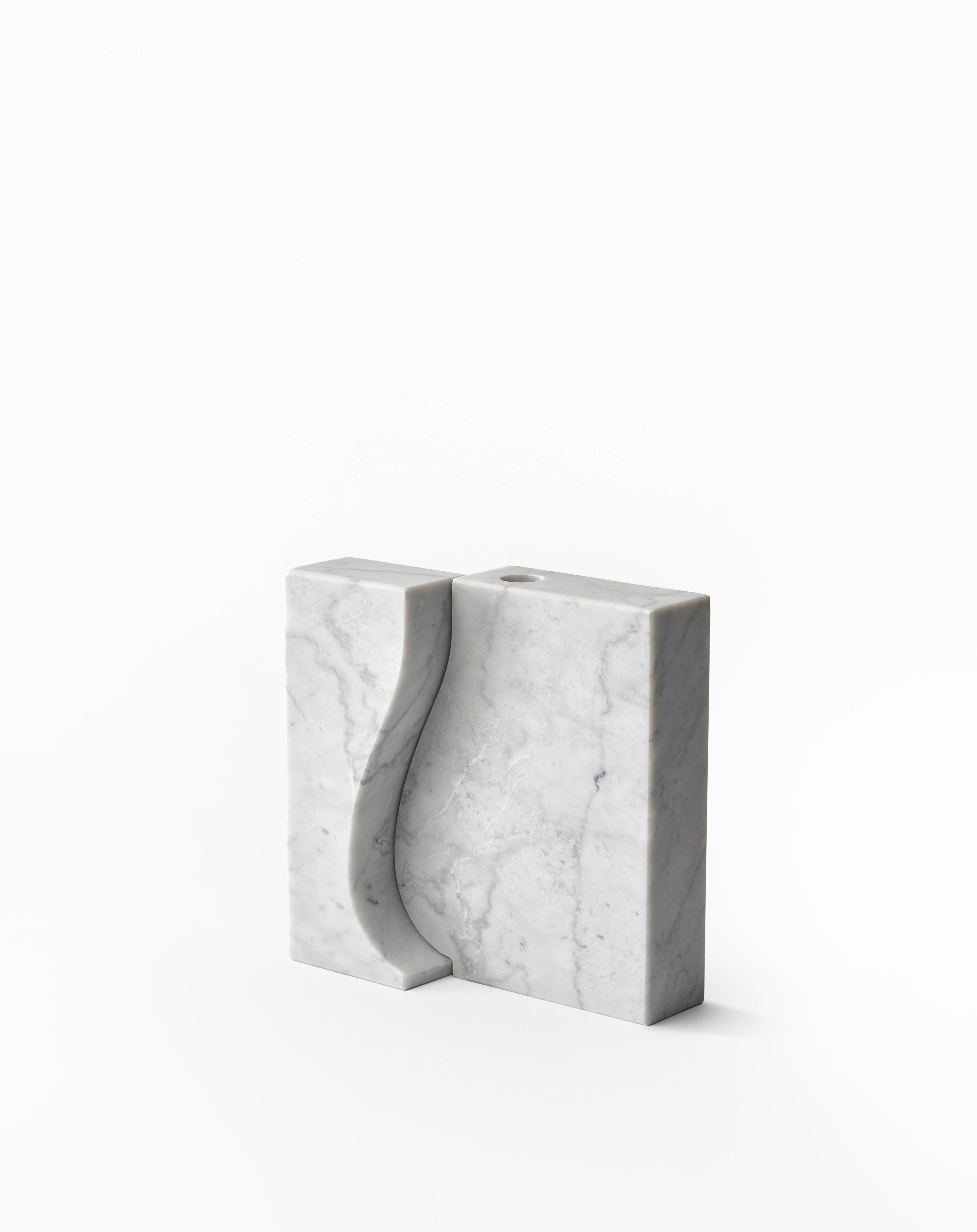 Small Recisi marble vase - Moreno Ratti
Dimensions: D 5 x W 20 x H 20 cm
Materials: White Carrara marble.
Available in other size and marble.

The memory of a children's game, like play with simple shape cut on paper.
The magic of the