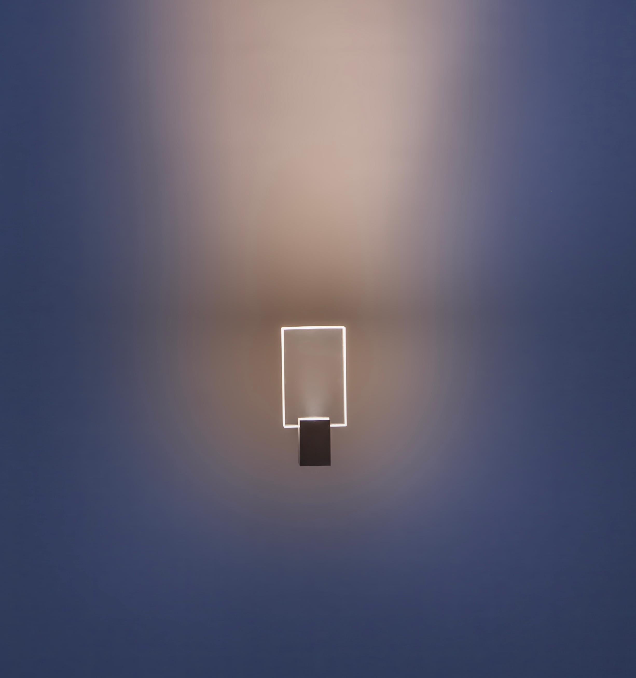 The small rectangle window light sculpture is a part of the window series from optical Monuments - a collection exploring the intersection of refraction, diffusion, transparency, and myth. The Window series uses optics by manipulating light to