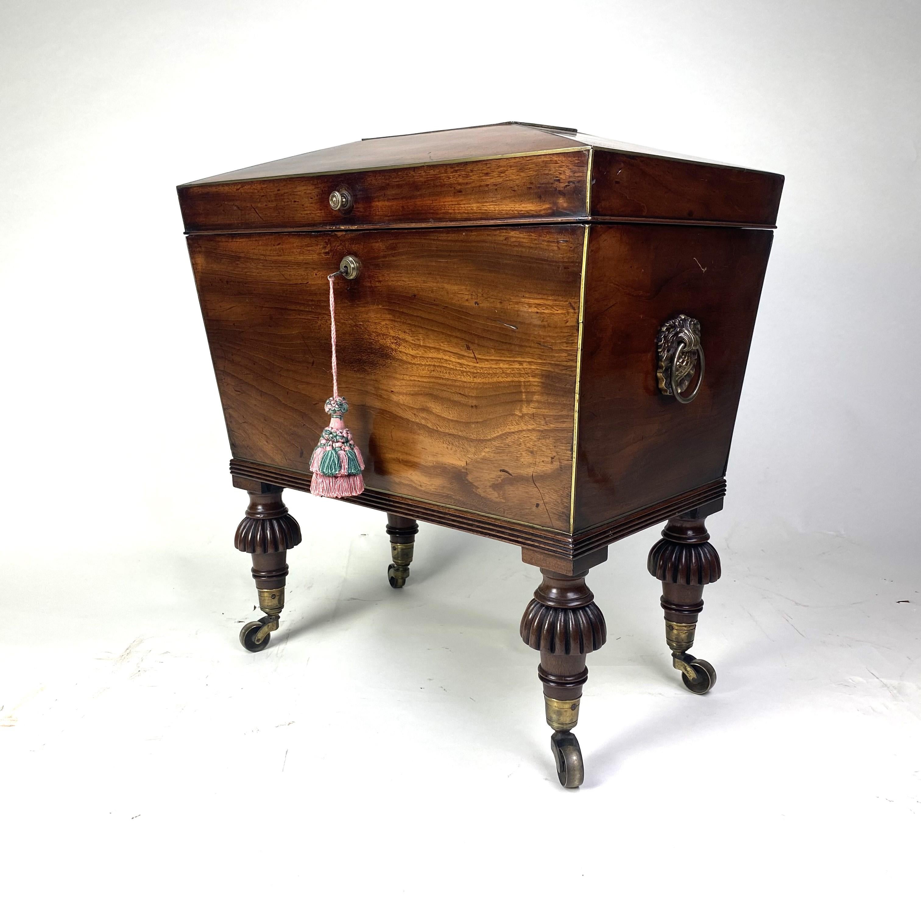 19th Century Small Regency mahogany sarcophagus shaped Cellarette For Sale