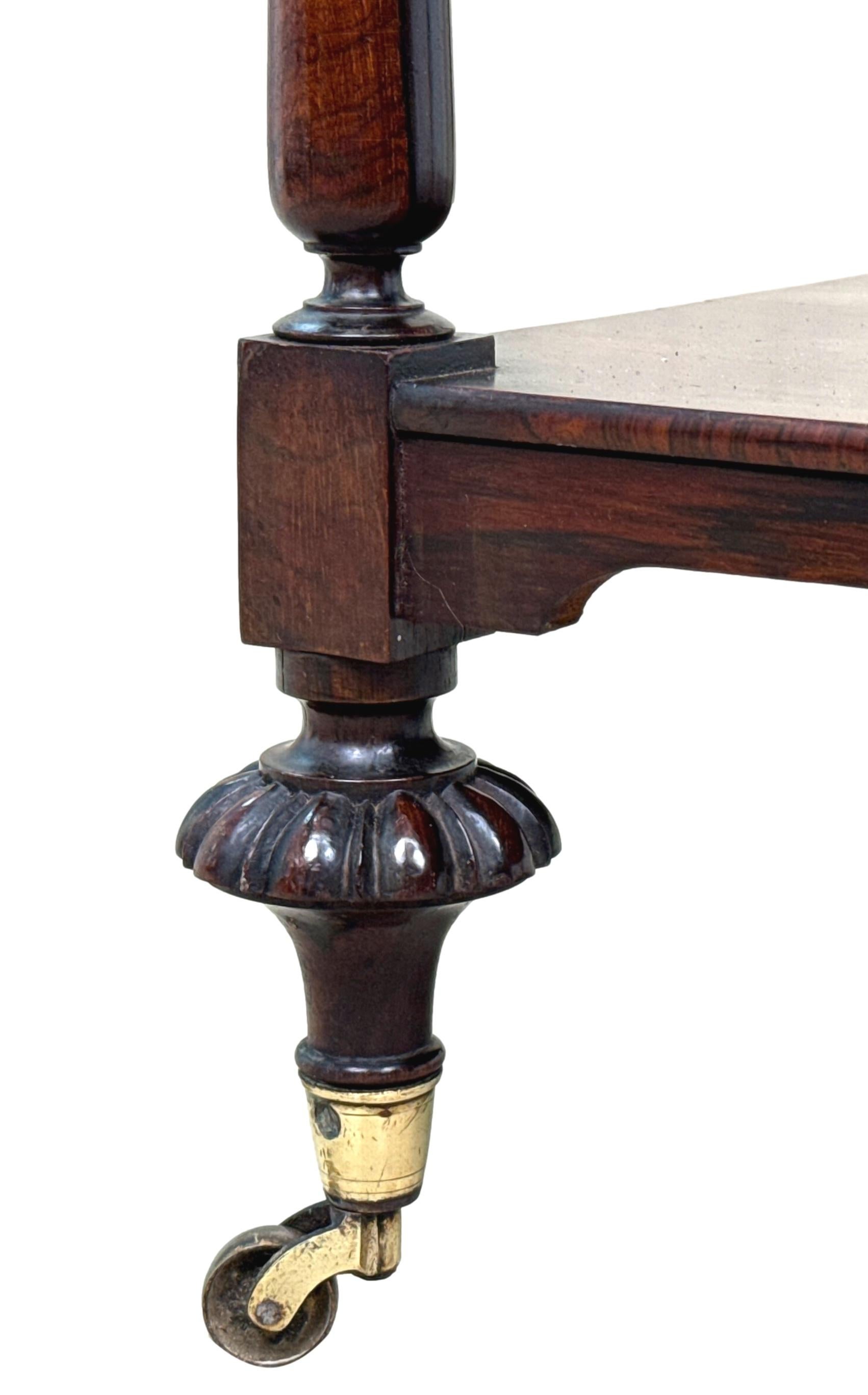 A Superb Quality 19th Century Regency Period Rosewood Whatnot, Or Etagere, Having Three Superbly Figured Tiers, United By Extremely Elegant Reverse Tapered Turned Upright Supports, Terminating On Richly Carved Turned Feet And Original Brass