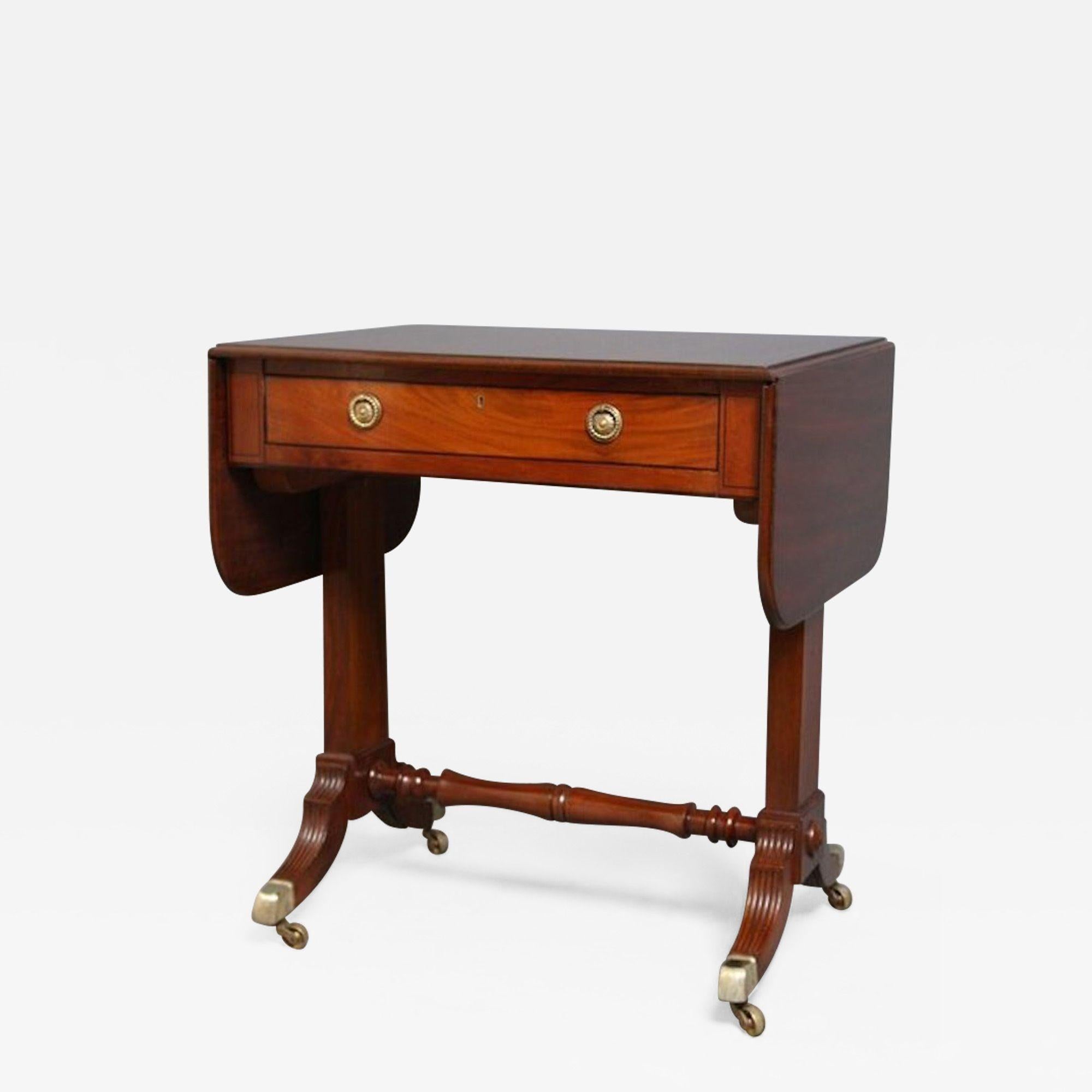 SN1181 Good quality, Regency, drop leaf, mahogany, sofa table of small proportions, having round end, moulded top, single drawer to frieze and dummy drawer to opposite side with original, brass handles and ebonised, string inlay to edge, standing on
