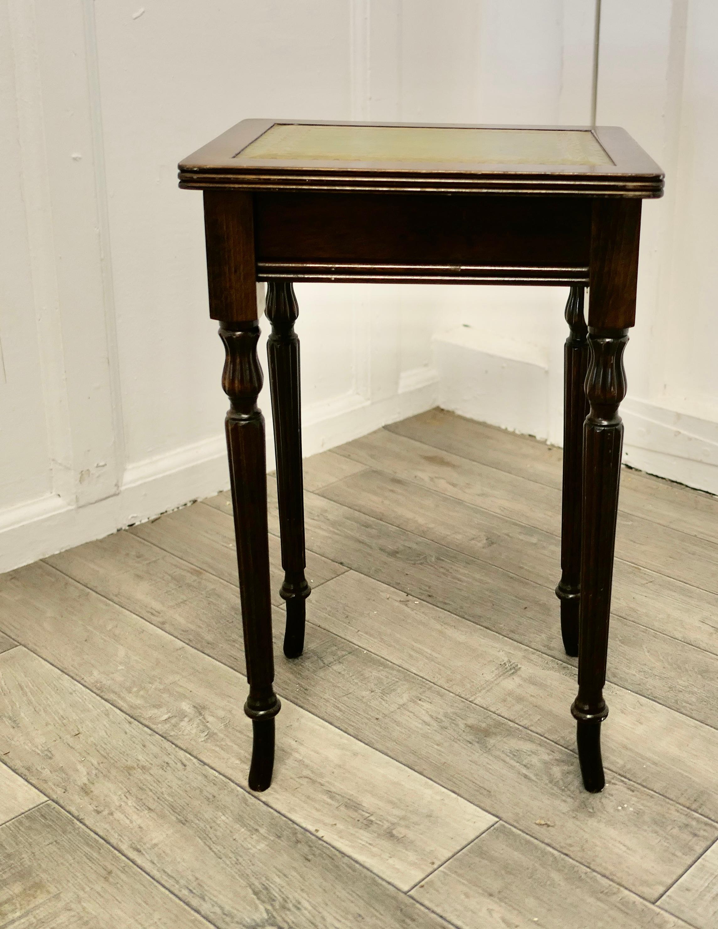 Small Regency style leather top lamp table

An elegant small table with dainty dark wood legs and an inset tooled moss green leather, it is an ideal size for a large lamp
The table 19” tall and 12” x 9.5”
TJK175.