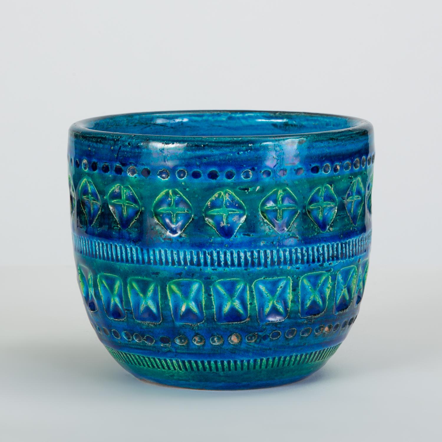 A small, deep bowl from the iconic “Rimini Blu” collection by Aldo Londi for Bitossi with its customary hand-incised geometry and variegated blue-and-green glaze. Signed with hand-painted edition number and “Italy” on bottom.

Condition: Excellent