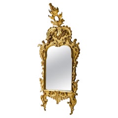 Small Rococò carved and gilded leaf mirror