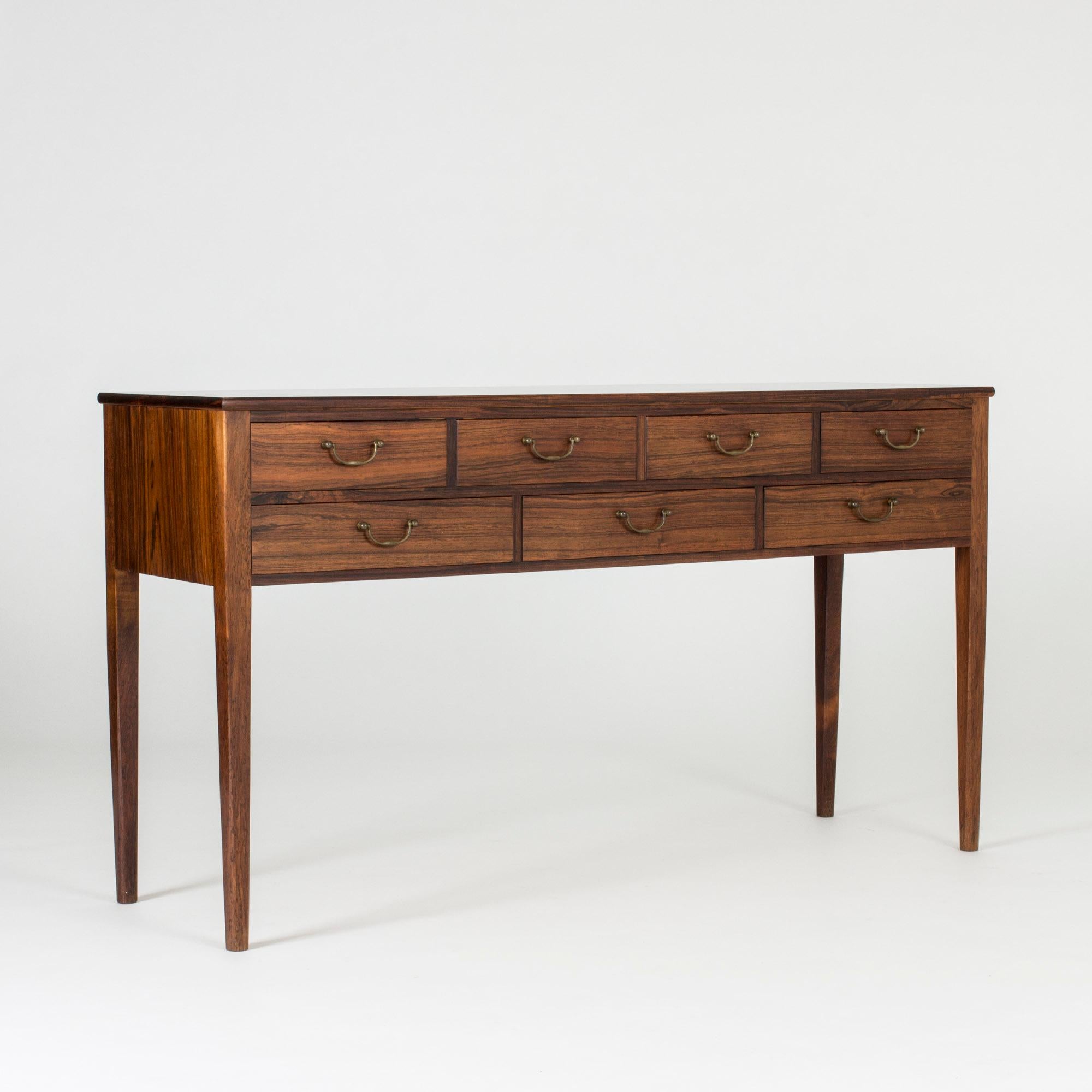 Small rosewood sideboard by Ole Wanscher in a light, neat design. Rich, dark wood, great proportions and beautiful execution.