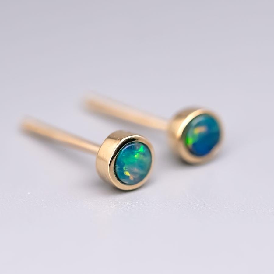 Small Minimalist Round Australian Doublet Opal Stud Earrings 14k Yellow Gold.


Free Domestic USPS First Class Shipping! Free Gift Bag or Box with every order!

Opal—the queen of gemstones, is one of the most beautiful gemstones in the world. Every
