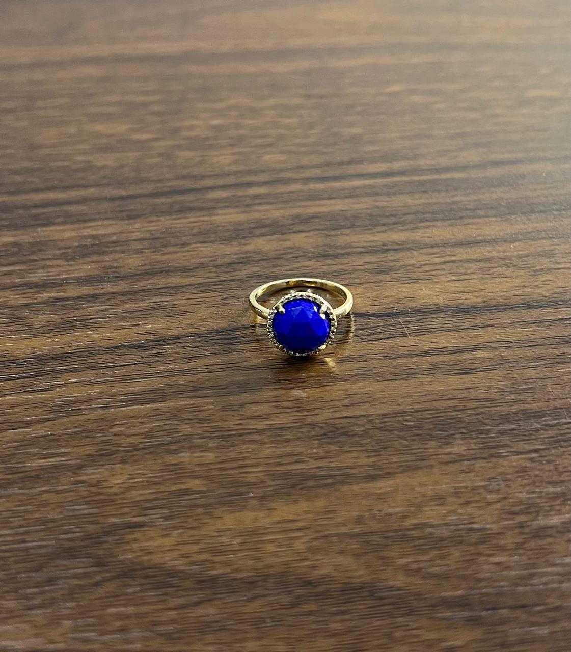 A striking Blue Lapis Lazuli and Diamond Ring, featuring a captivating 10MM 1.83ct Blue Lapis Lazuli set in 14k Gold, accented with 0.17ct Diamonds.
