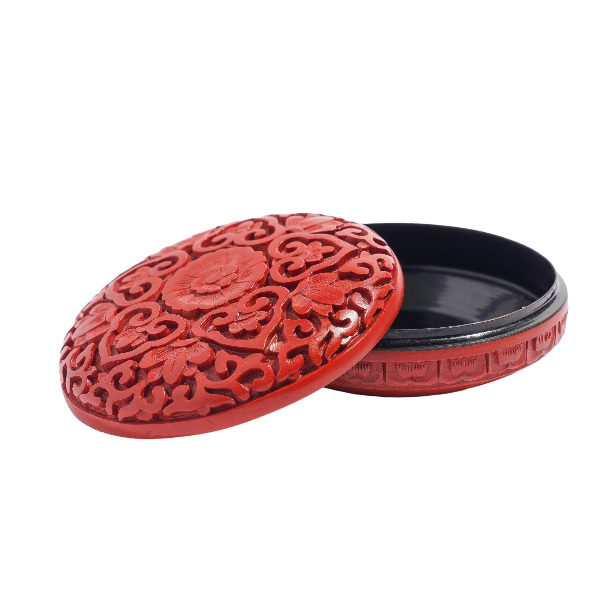 Traditional cinnabar covered round box with black lacquered interior.
China, Republic period, circa 1950.

Dimensions: 3