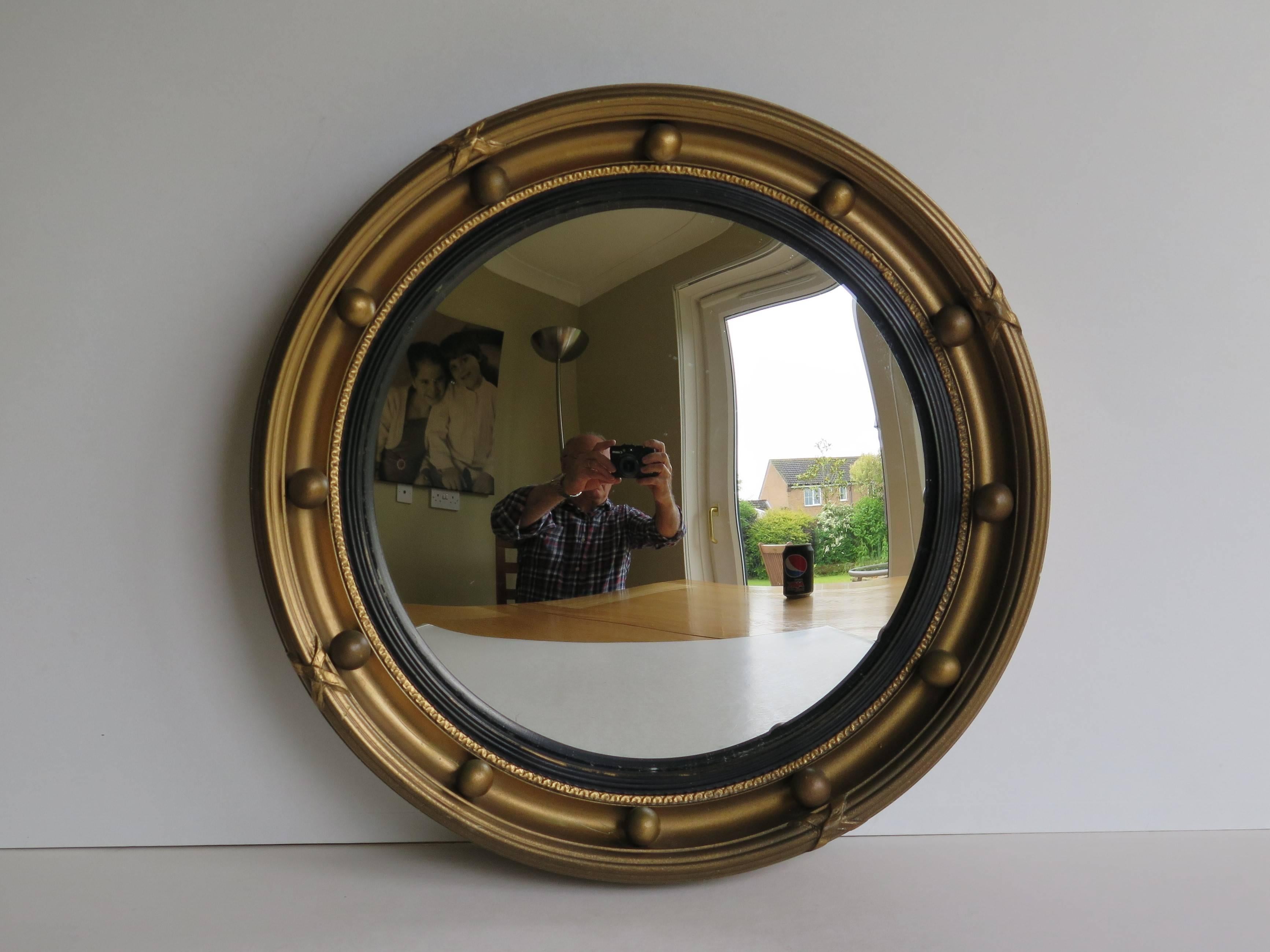 This is a good circular Convex gilt mirror in a popular Georgian Regency Style. 

This is a very decorative piece, with small diameter wall mirrors in this style being very hard to find and much rarer. The diameter is 10.5 inches.

The frame is