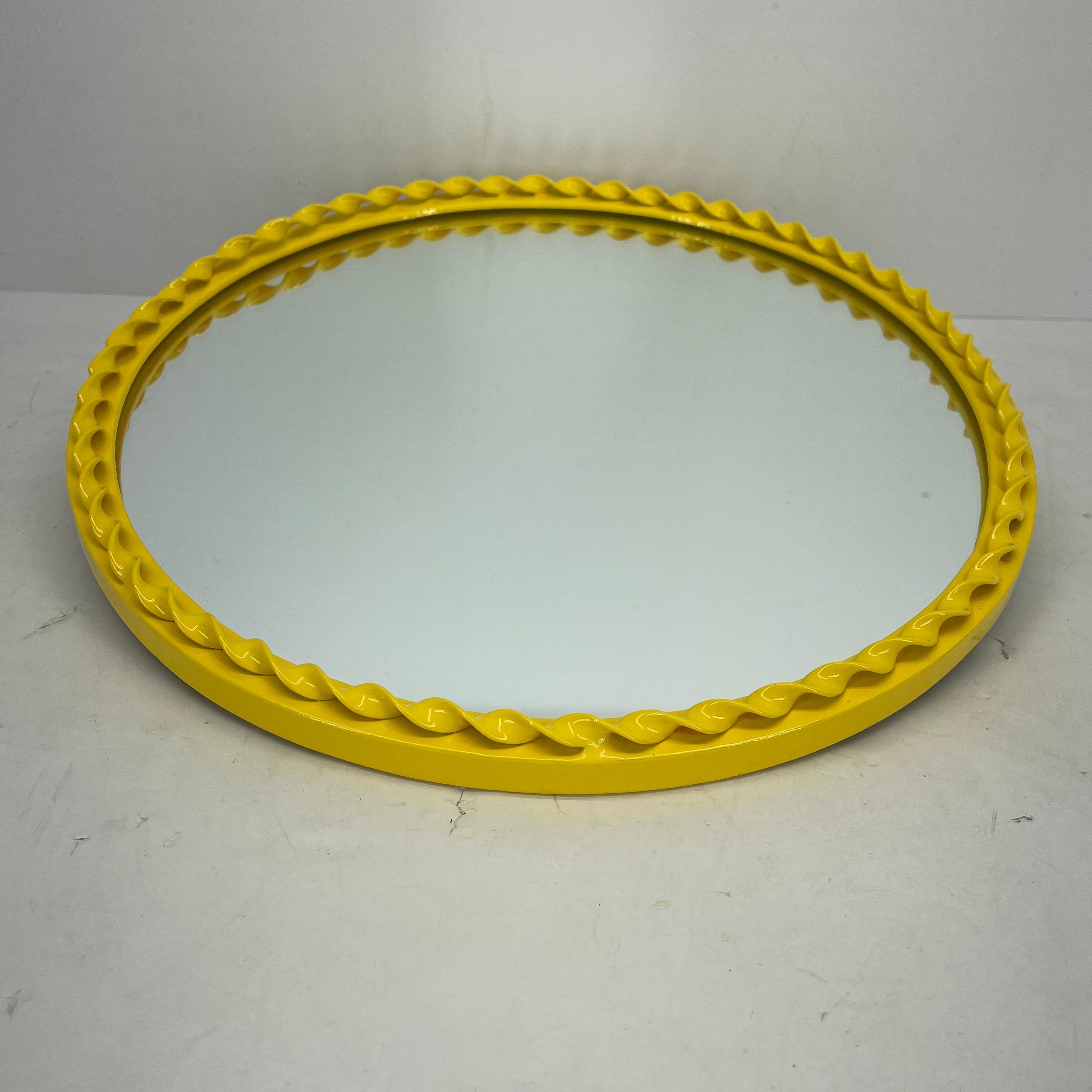Round Mid-Century Modern bright yellow powder coated metal wall mirror.
The mirror is newly powder-coated.