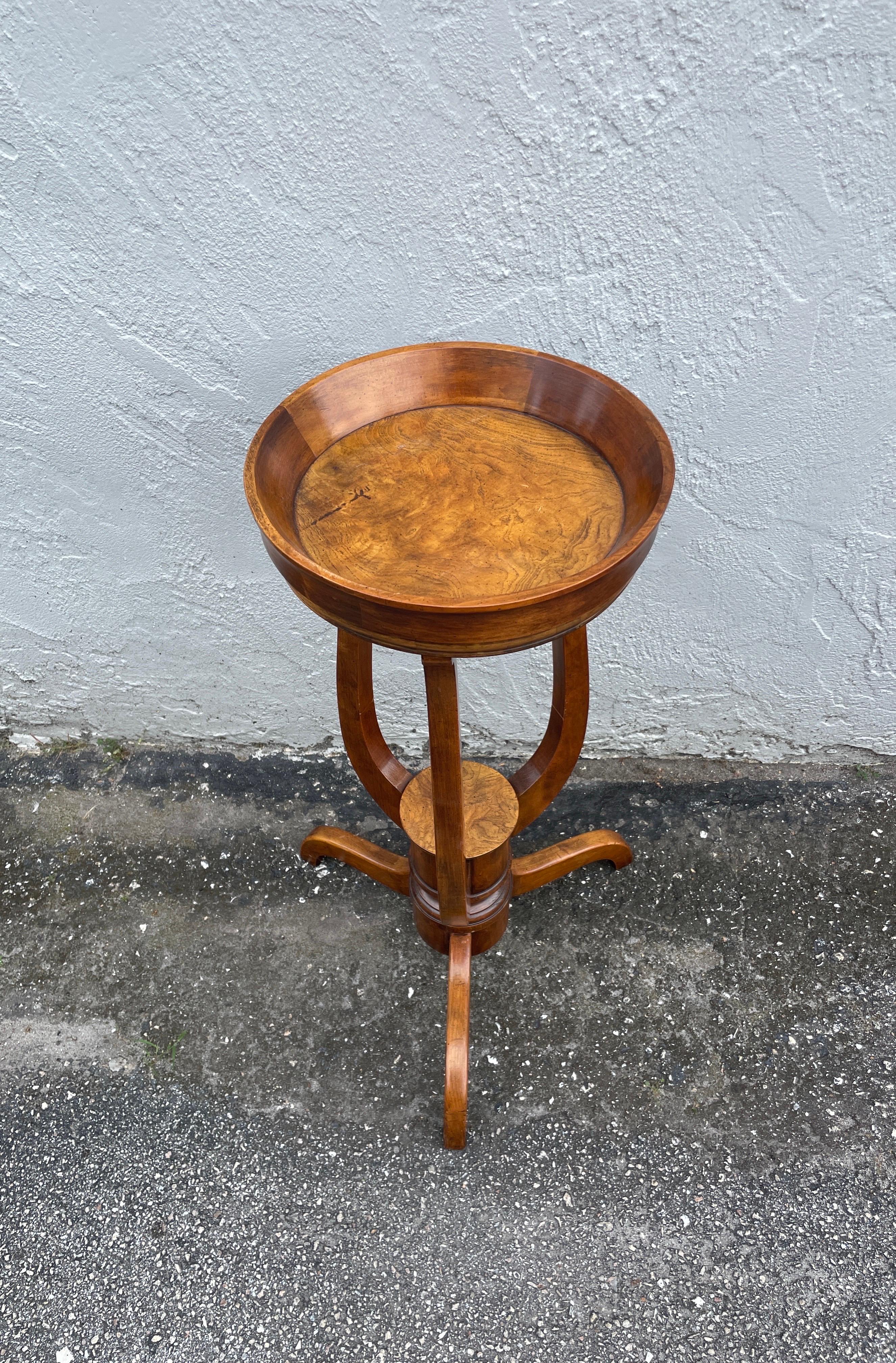 Vintage round side / drinks table by Baker Furniture Co. Beautiful Burlwood top.  Can also be used as a stand or pedestal.