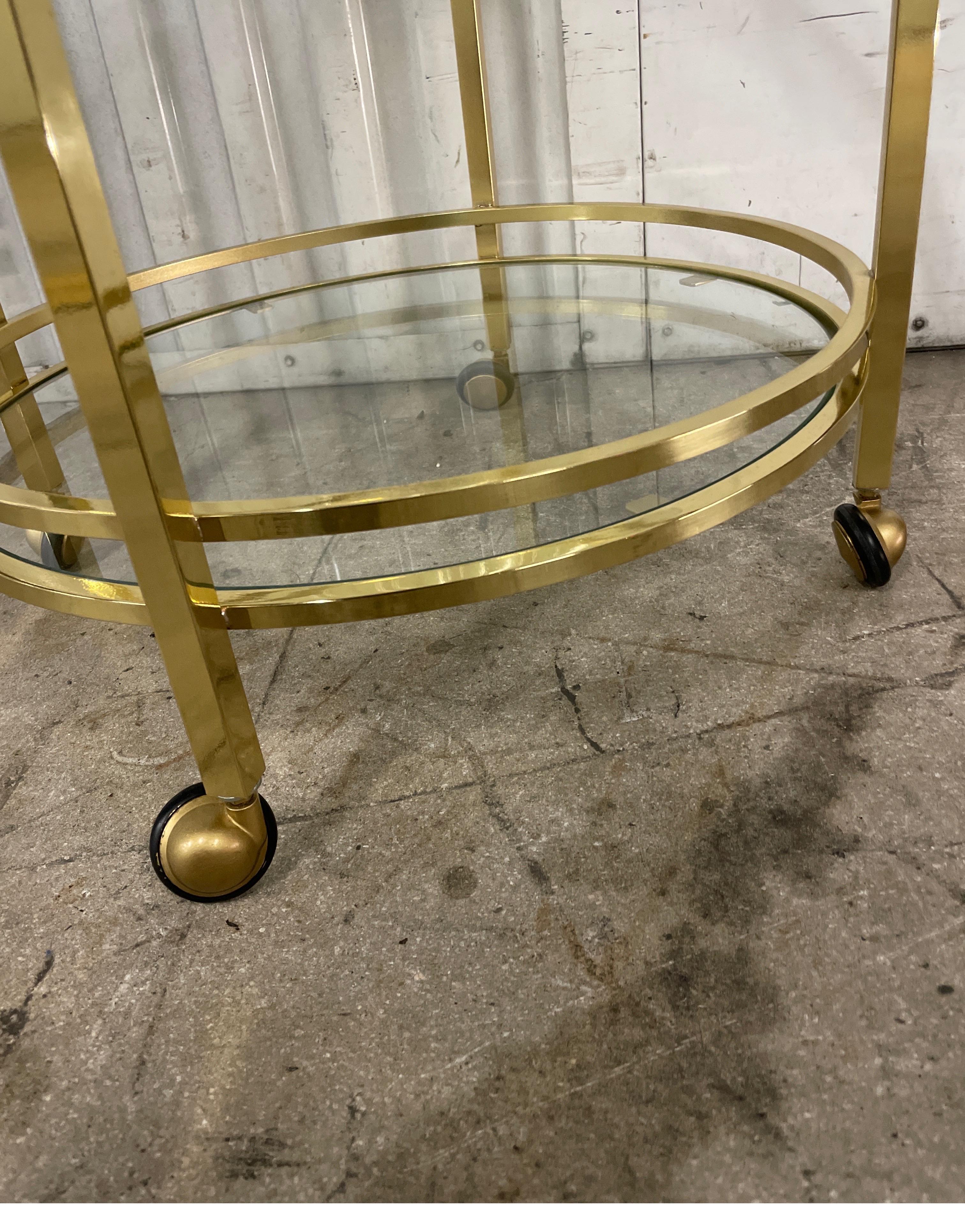 Italian Small Round Two Tiered Brass & Glass Side Table on Casters For Sale
