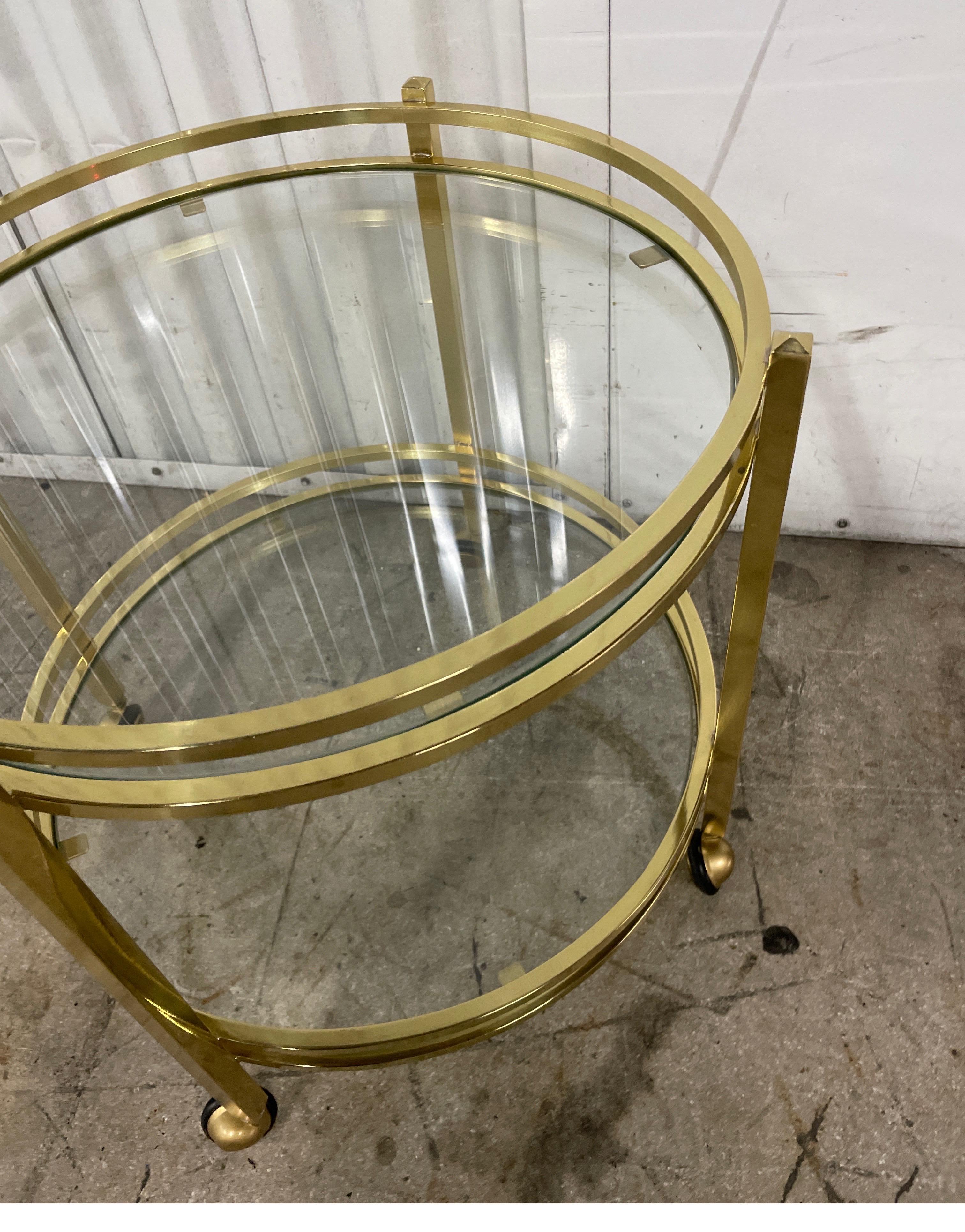 Small Round Two Tiered Brass & Glass Side Table on Casters In Good Condition For Sale In West Palm Beach, FL