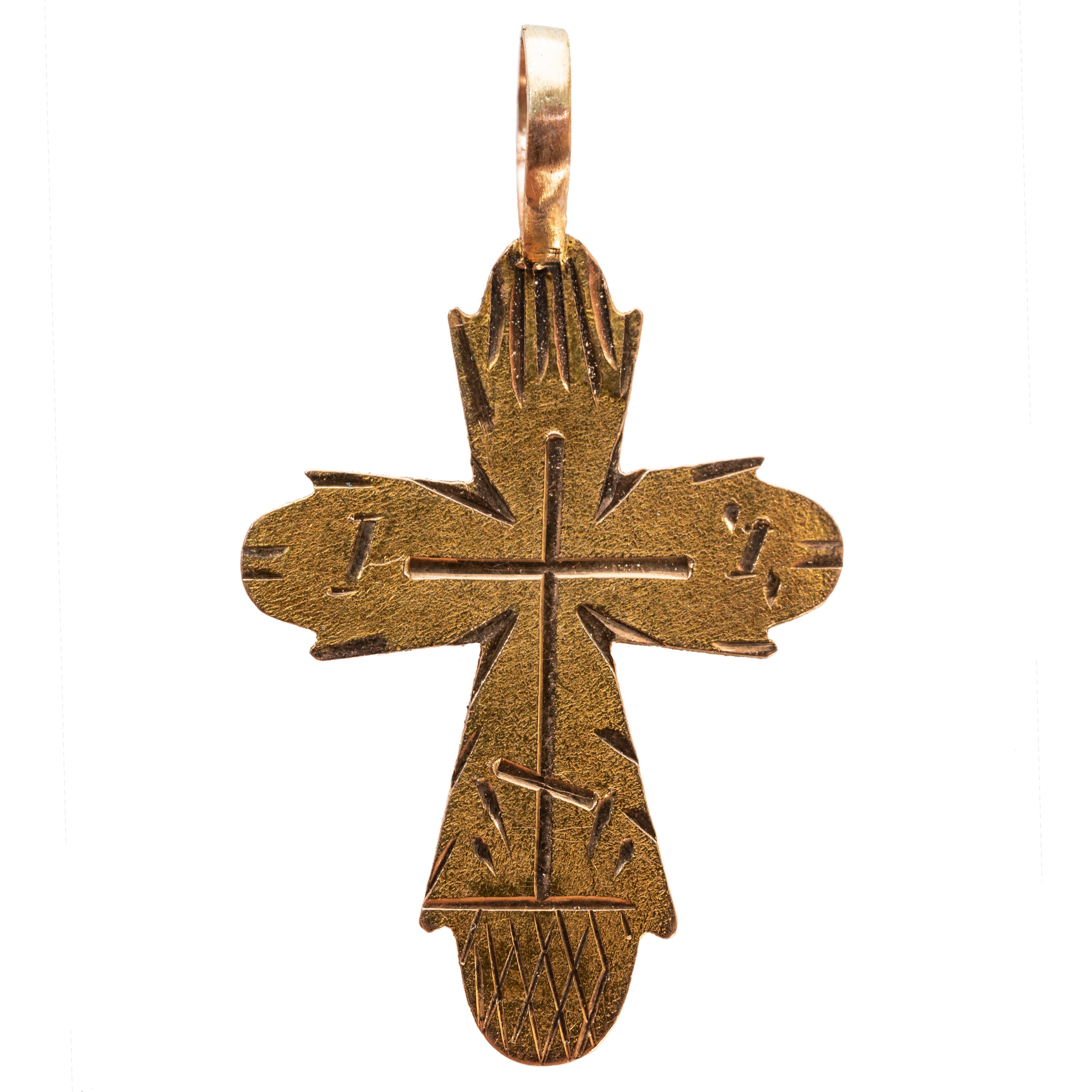 From the Romanov era, period of Tsar Nicholas II, a gold cross from the ancient capital of Moscow, the front engraved with a central cross.

1899-1908, with Russian maker’s mark. 

1 1/8 x 3/4 in  (2.9 x 1.9 cm.) (l x w)
