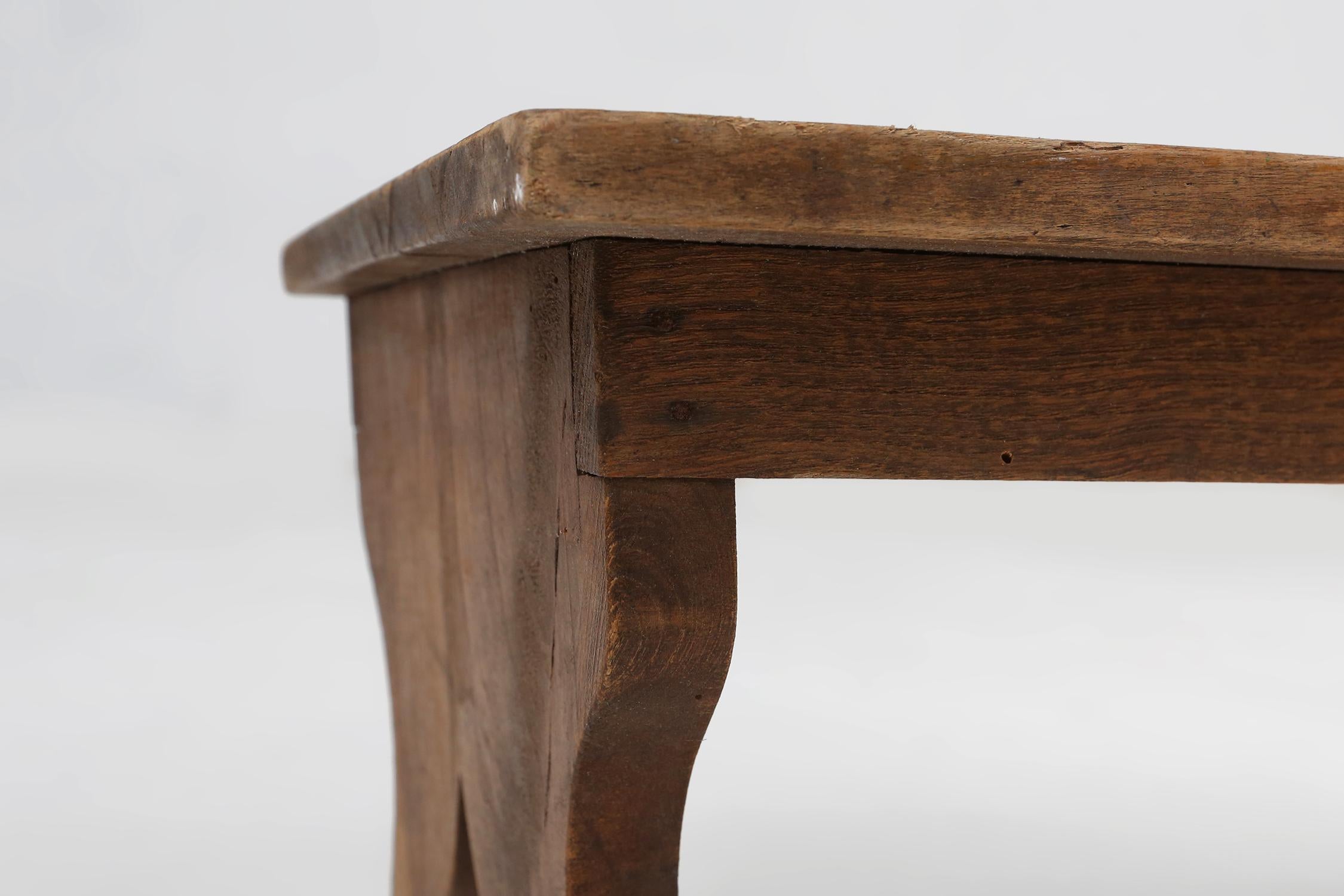 Early 20th Century Small rustic wooden stool with curved base, France ca. 1900 For Sale