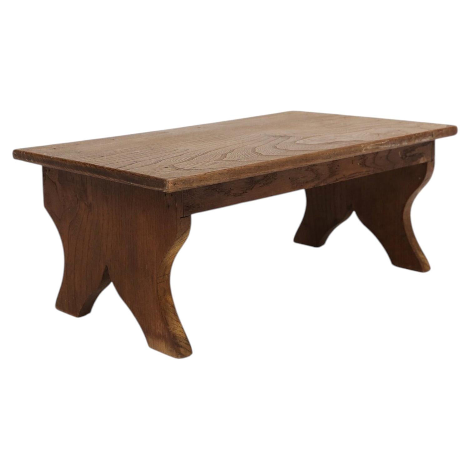Small rustic wooden stool with curved base, France ca. 1900 For Sale