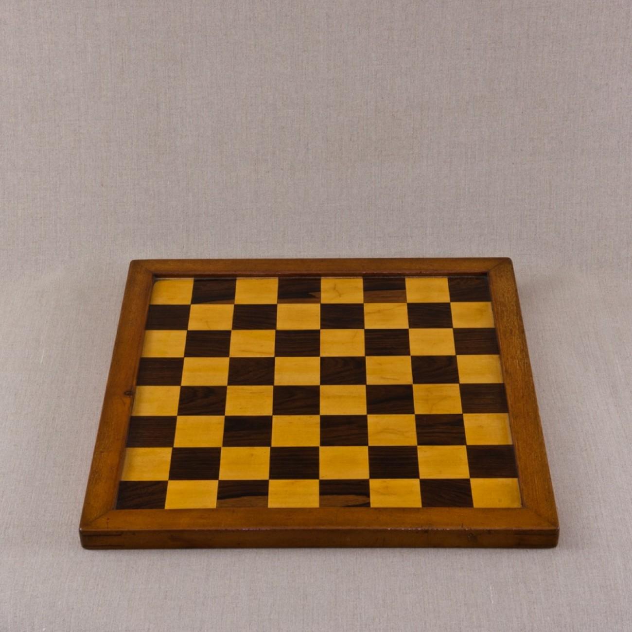 A fabulous smaller scale mahogany framed chess board with mahogany back and squares of satinwood and rosewood (probably made by Jaques of London but missing label), circa 1920.

Dimensions: 44.5 cm/17½ inches x 44.5 cm/17½ inches. Size of squares