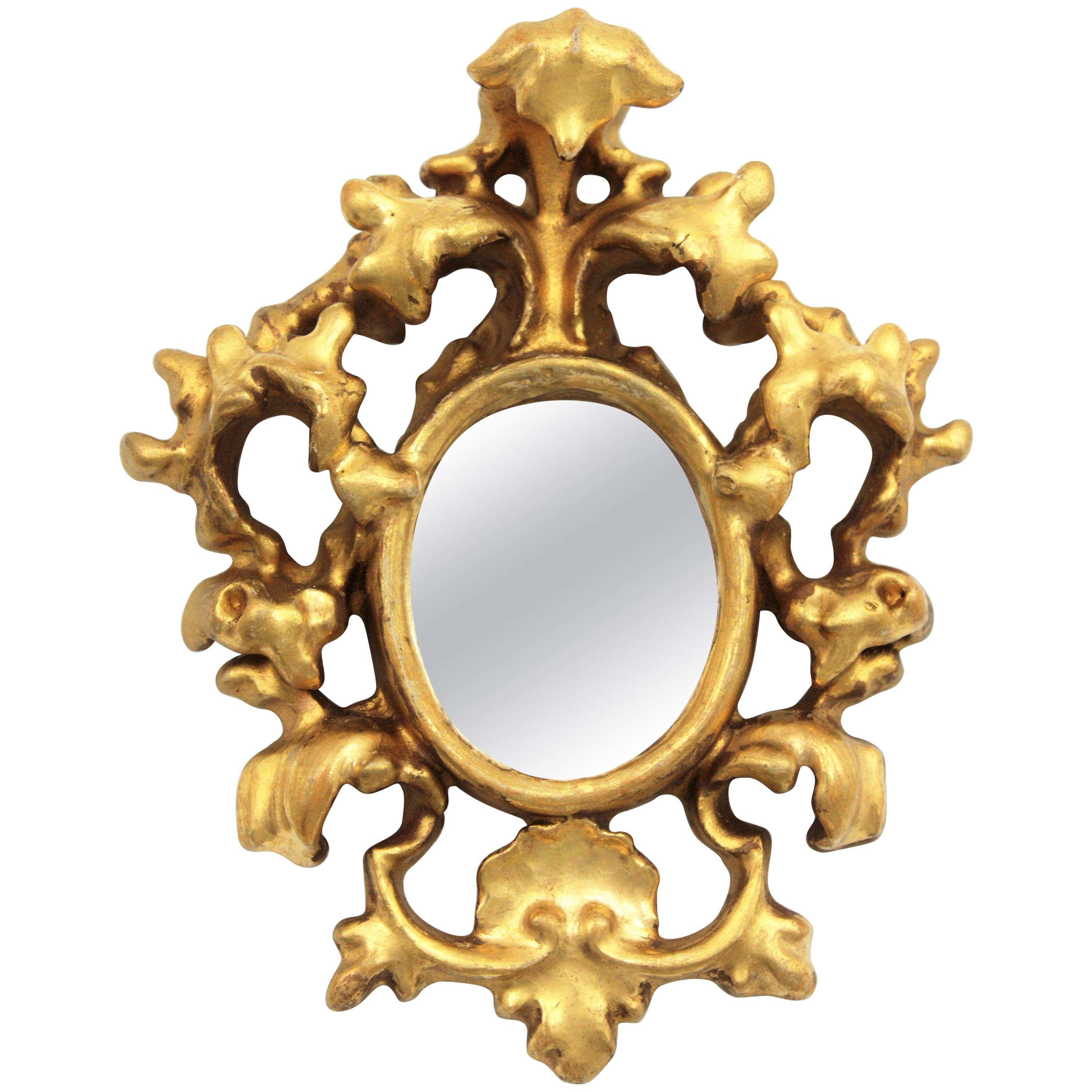 Spanish 1930s Baroque style carved gold leaf giltwood and gesso mirror miniature
Unusual Baroque style handcrafted miniature mirror made of wood and gesso and finished with gold leaf.
It has been restored preserving its original antique patina.