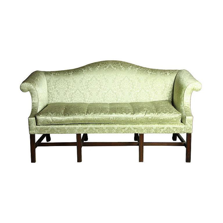 This is a small-scale sofa (68 in. wide) supported on four molded legs, giving it a very stabile appearance. The lines are Classic. See the attached images of when Levy had it up holstered and other related examples, including J. Walton. It is a gem
