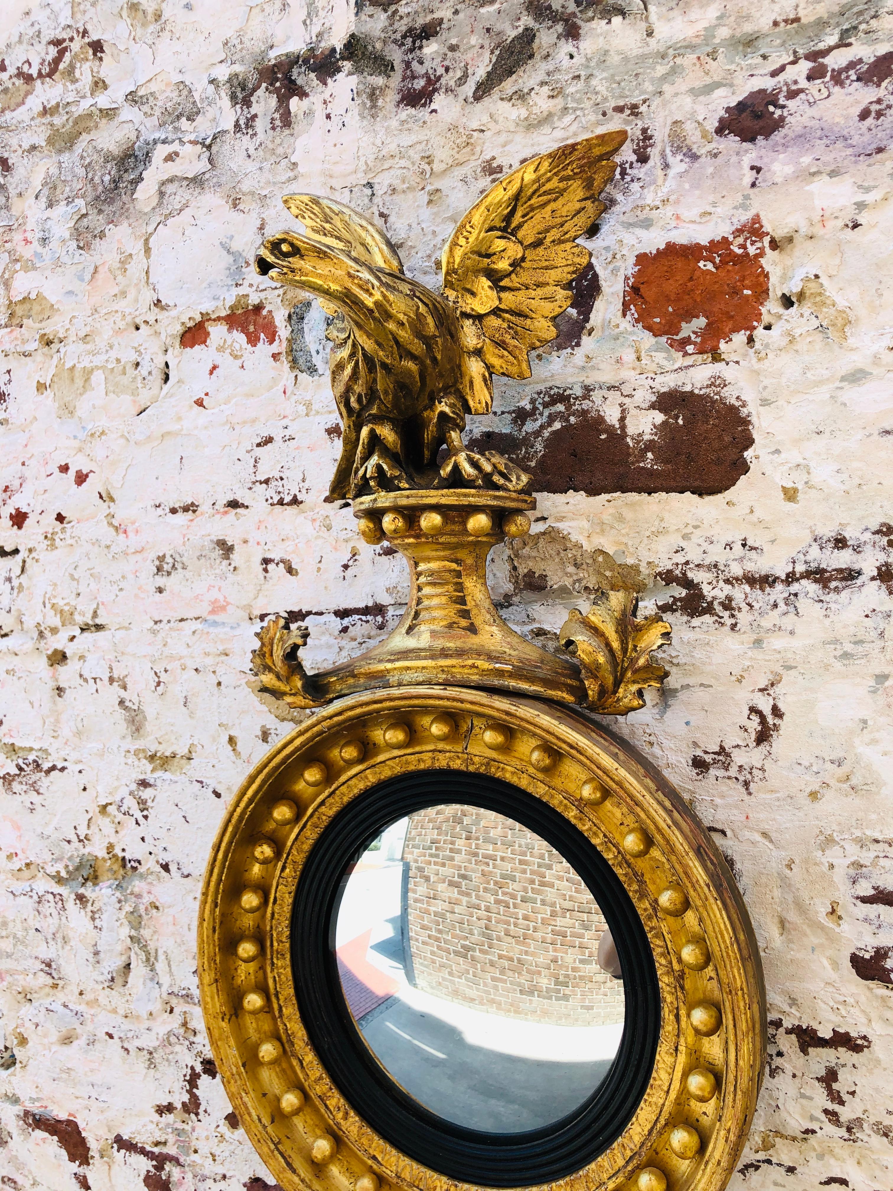 Small scale English convex mirror with London makers stamp, circa 1820.