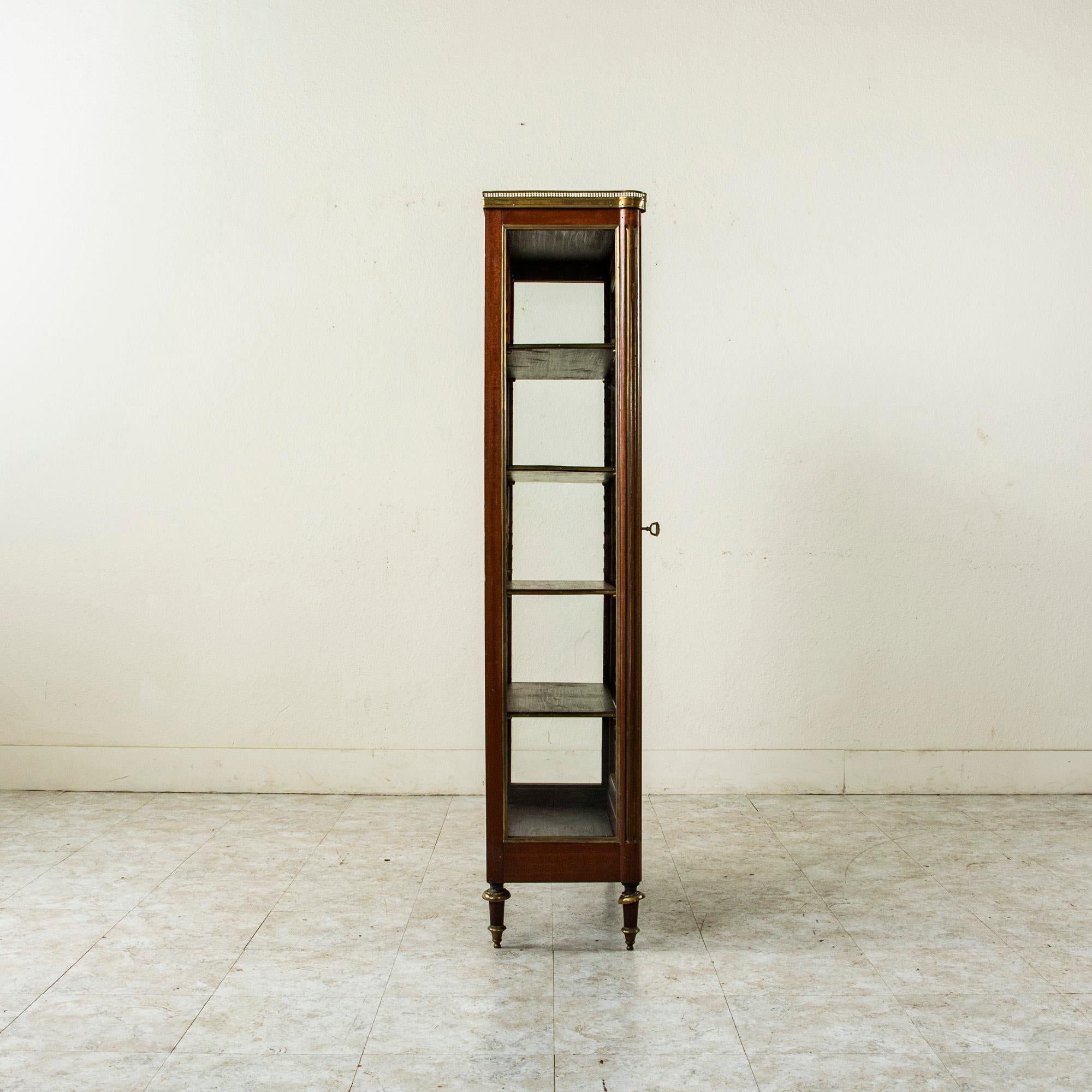 small antique bookcase with glass doors