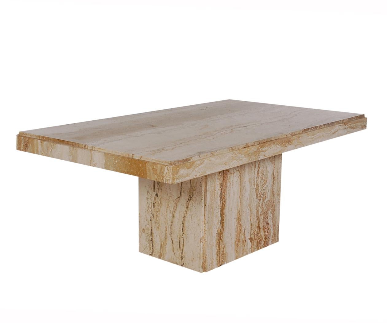 A nice smaller scale coffee table from the 1970s and made in Italy. It features 100% travertine construction with gorgeous veining.
