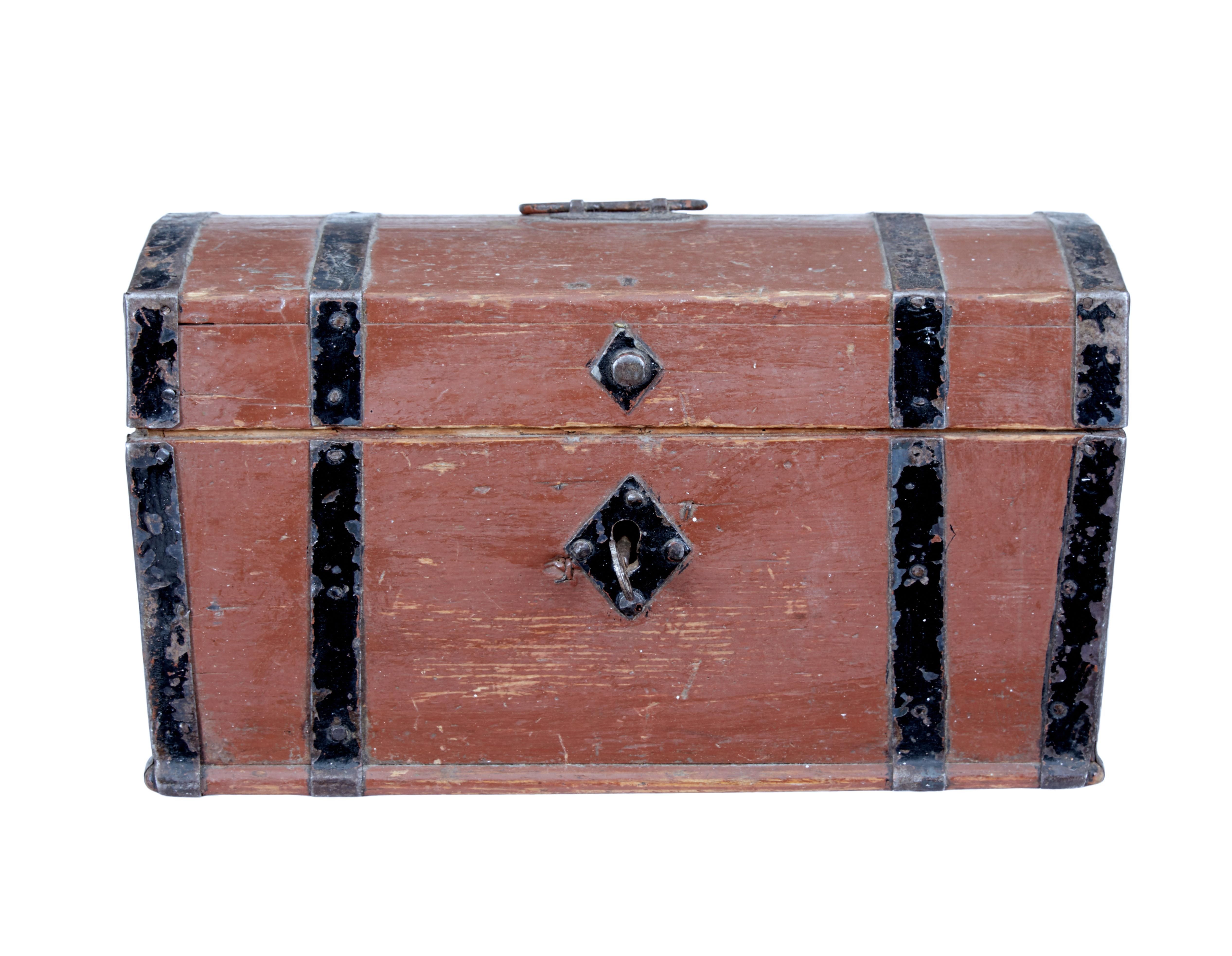 Small Scandinavian 19th century painted pine dome top box circa 1870.

Character painted pine box with black painted strap work and handle. Working lock and key, but is a lock you need to learn with. 

Expected minor losses to woodwork and