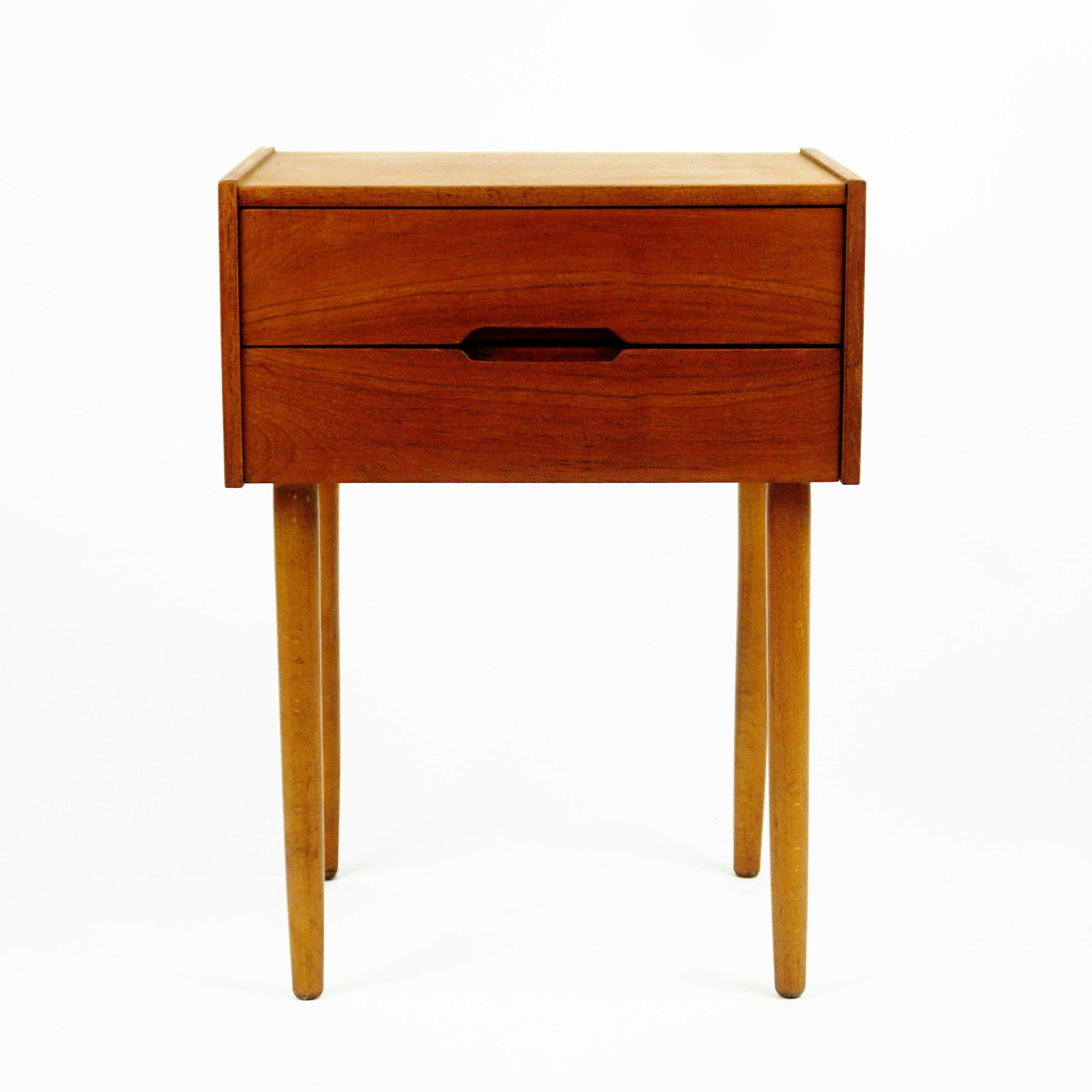 Charming Scandinavian modern chest of drawers manufactured by Aksel Kjersgaard, Odder, Denmark 1960s.
This excellent small piece of Furniture features two drawers. 
It can be used as a nightstand or as well in the wardrobe. 
Authentic example for