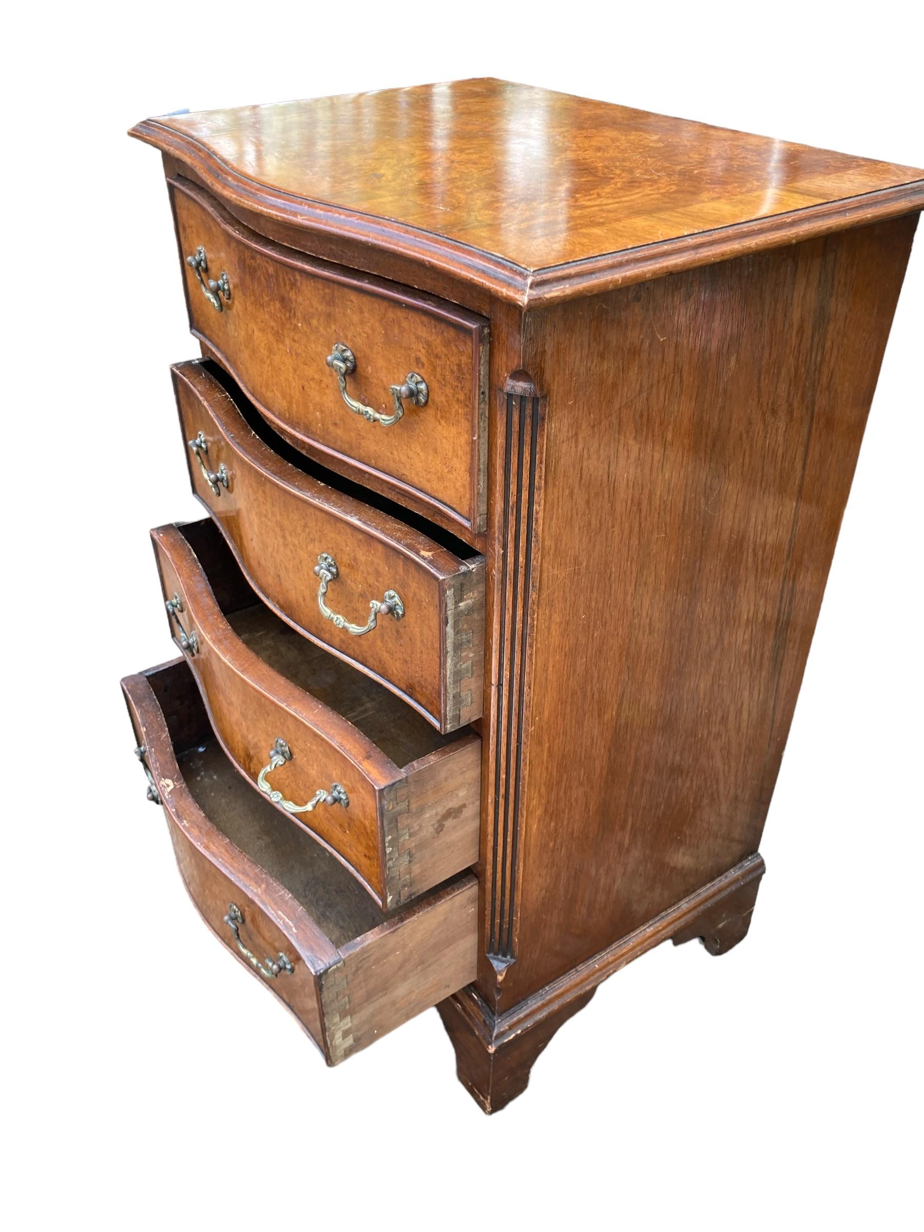 Veneer Small serpentine burr walnut veneered chest of drawers. For Sale