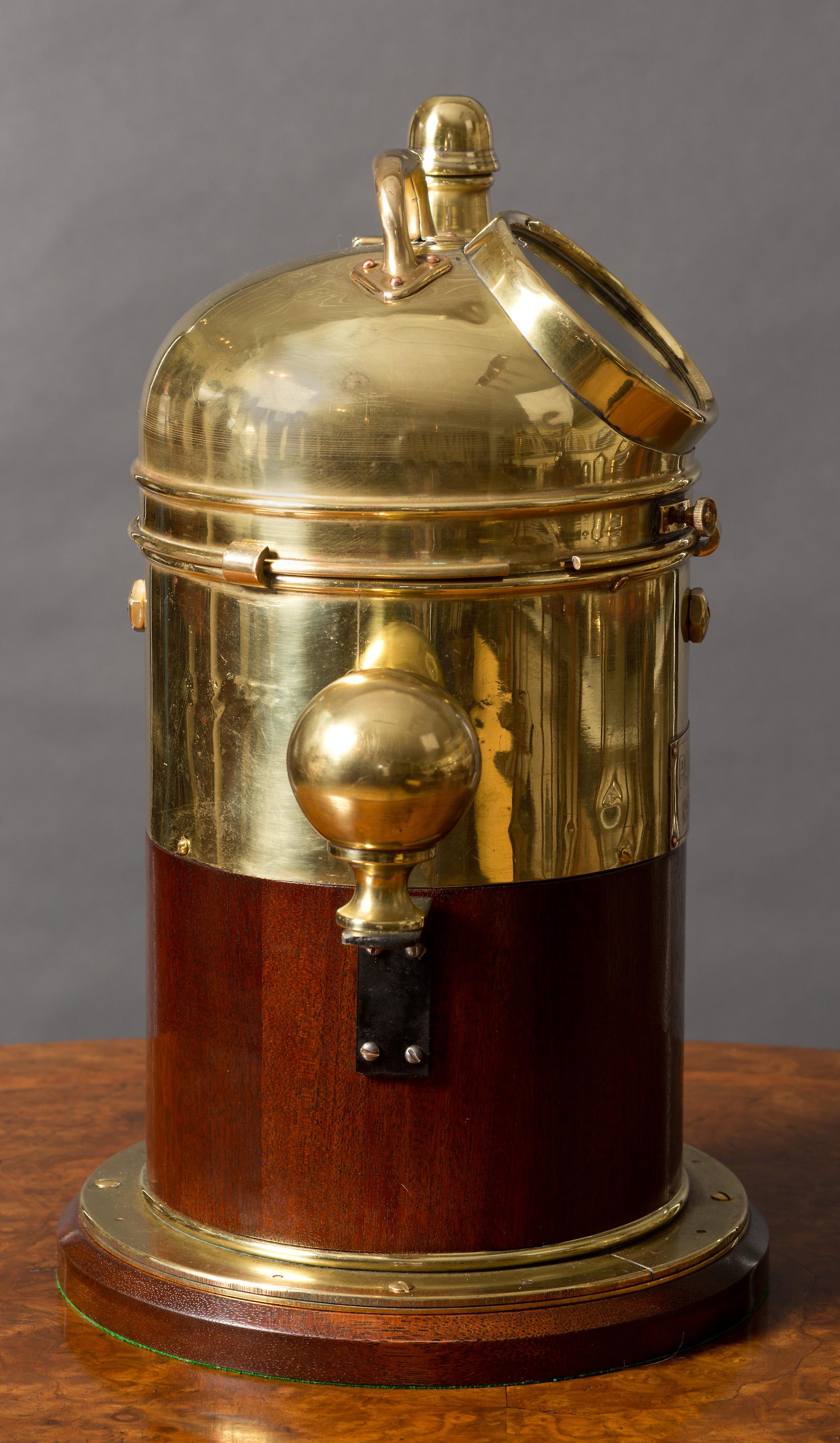 Ships Binnacle


Ships binnacle with wooden body standing on a later mahogany base supporting the brass casing with glazed aperture to view the inset compass mounted on brass gimbals.

Two brass Kelvins balls to either side, circa 1920.

 