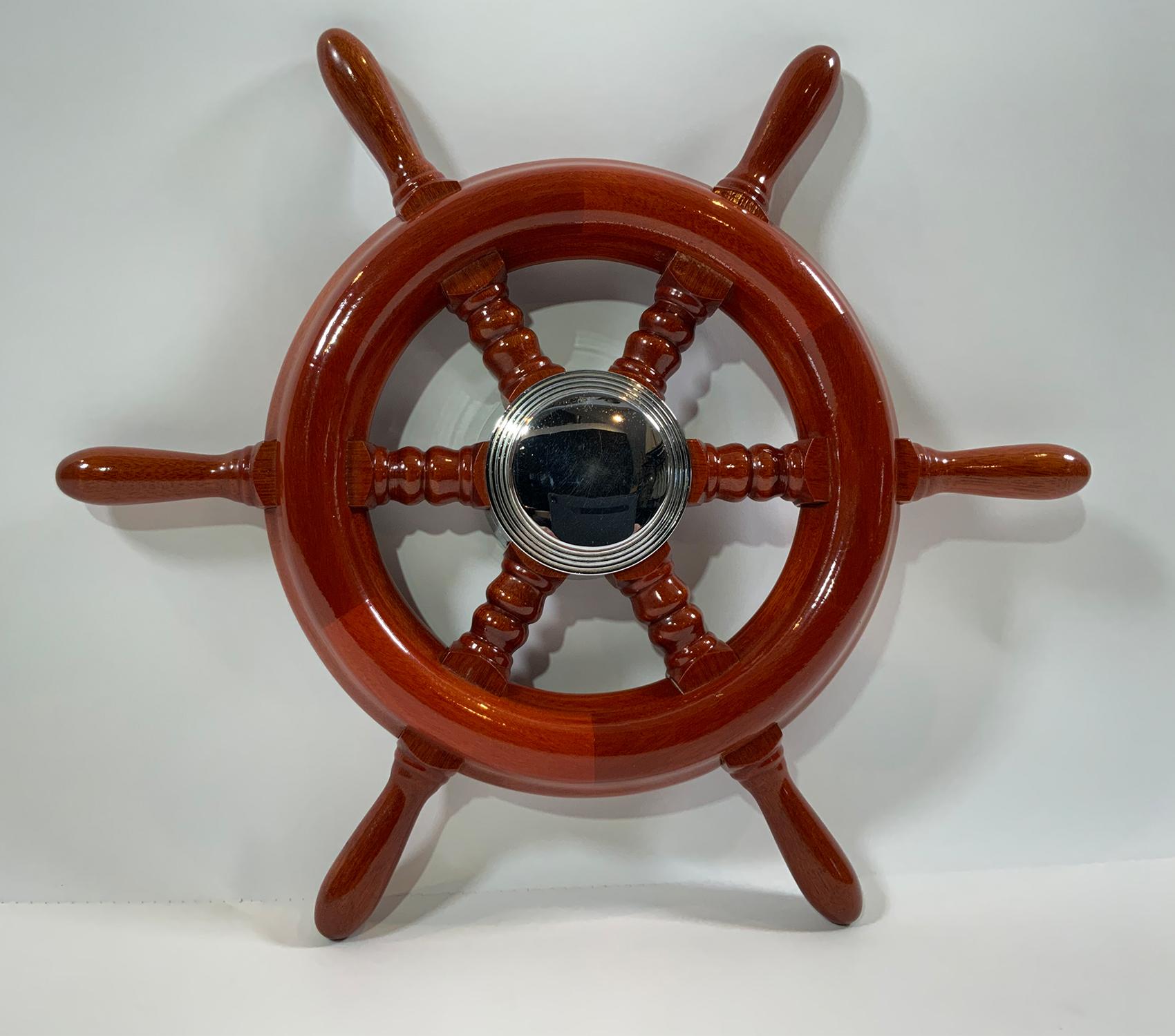 Six spoke varnished ships wheel with chrome hub. Very clean. Appears to be new old stock. Quite decorative or put it on your boat.

Weight: 3 LBS
Overall Dimensions: 17