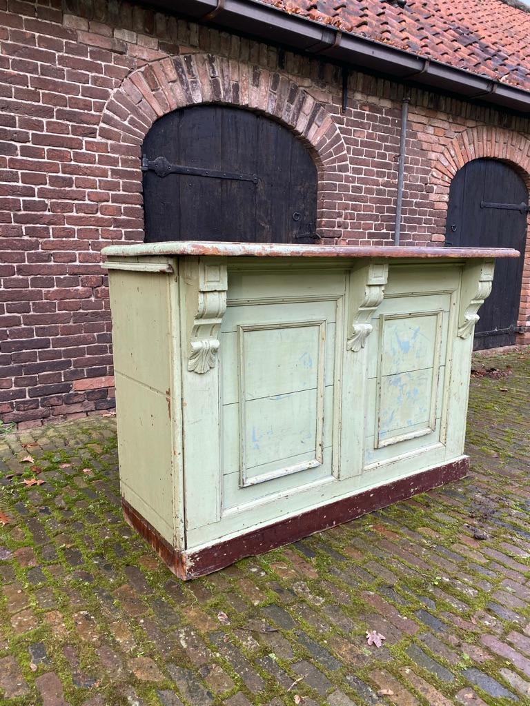 Beautiful old, pine, shop counter from a boutique shop in France. This patinated small counter or bar would not look out of place in any interior. Also nice as a bar or in the kitchen or bathroom or make it in to a working space. The counter has