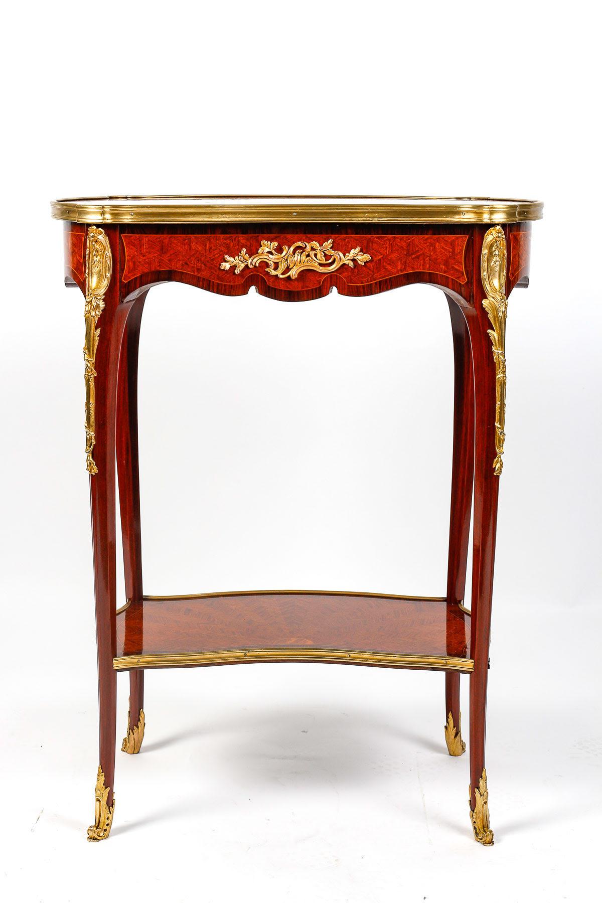 Small side table, end of sofa, Louis XV style, 19th century.

Small side table, end of sofa in marquetry and gilt bronze in the Louis XV style, Napoleon III period.    

h: 73cm , w: 56cm, d: 36cm