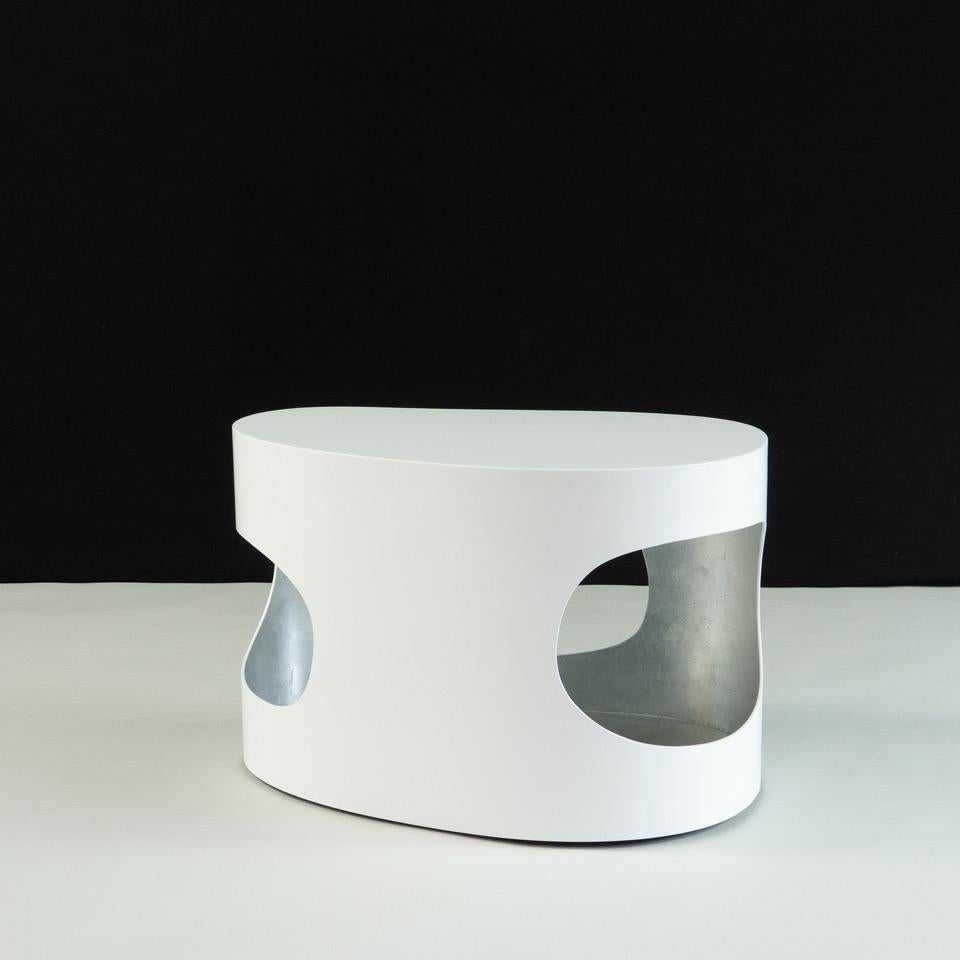 Organic shaped small coffee or side table by Jacques Jarrige.
White lacquer exterior, silver leaf interior.
  