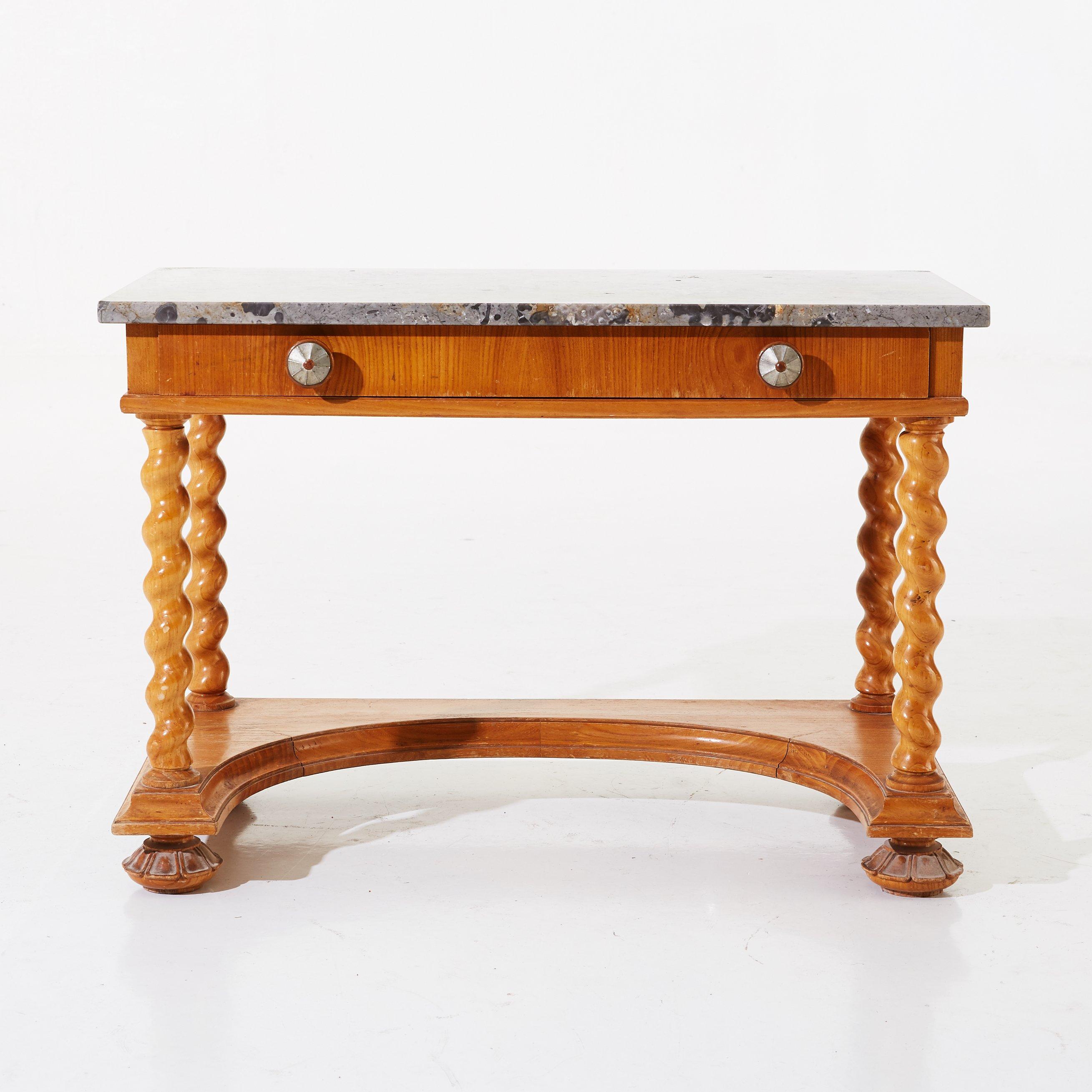 A stellar example of 1920’s classicism, this distinctive petite side table features a rich marble top, elm veneer frame with drawer, spiral-turned legs and pull fittings with metal inlay. Offered as is.

Measures: H 21.7