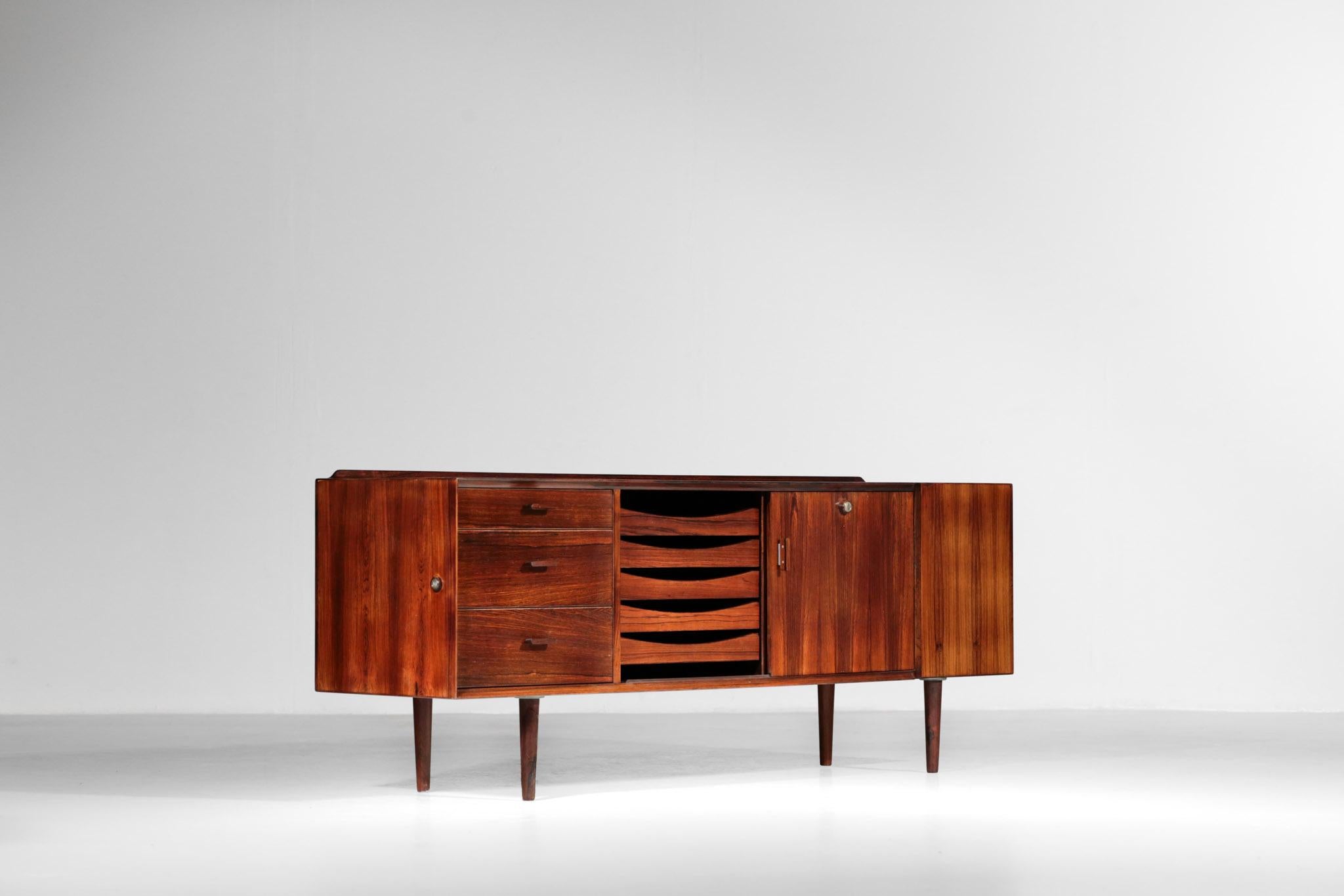 Small Scandinavian sideboard by Arne Vodder for Sibast. 
This sideboard is made of rosewood and composed of 3 drawers, 5 drawers paper and 2 doors on the right. 
Really nice manufacture. No key.