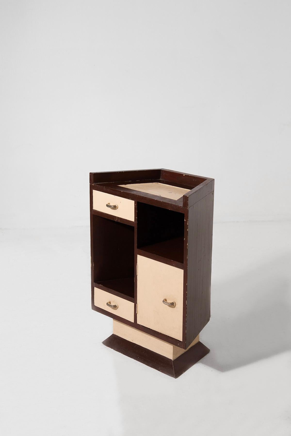 Embrace the bold, innovative spirit of the Italian Futurist period with this charming small sideboard from the 1920s-30s. Crafted during a dynamic era of artistic exploration, it features robust construction with a rich blend of contrasting beige