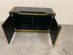 Small sideboard in blackened oak and brass circa 1970