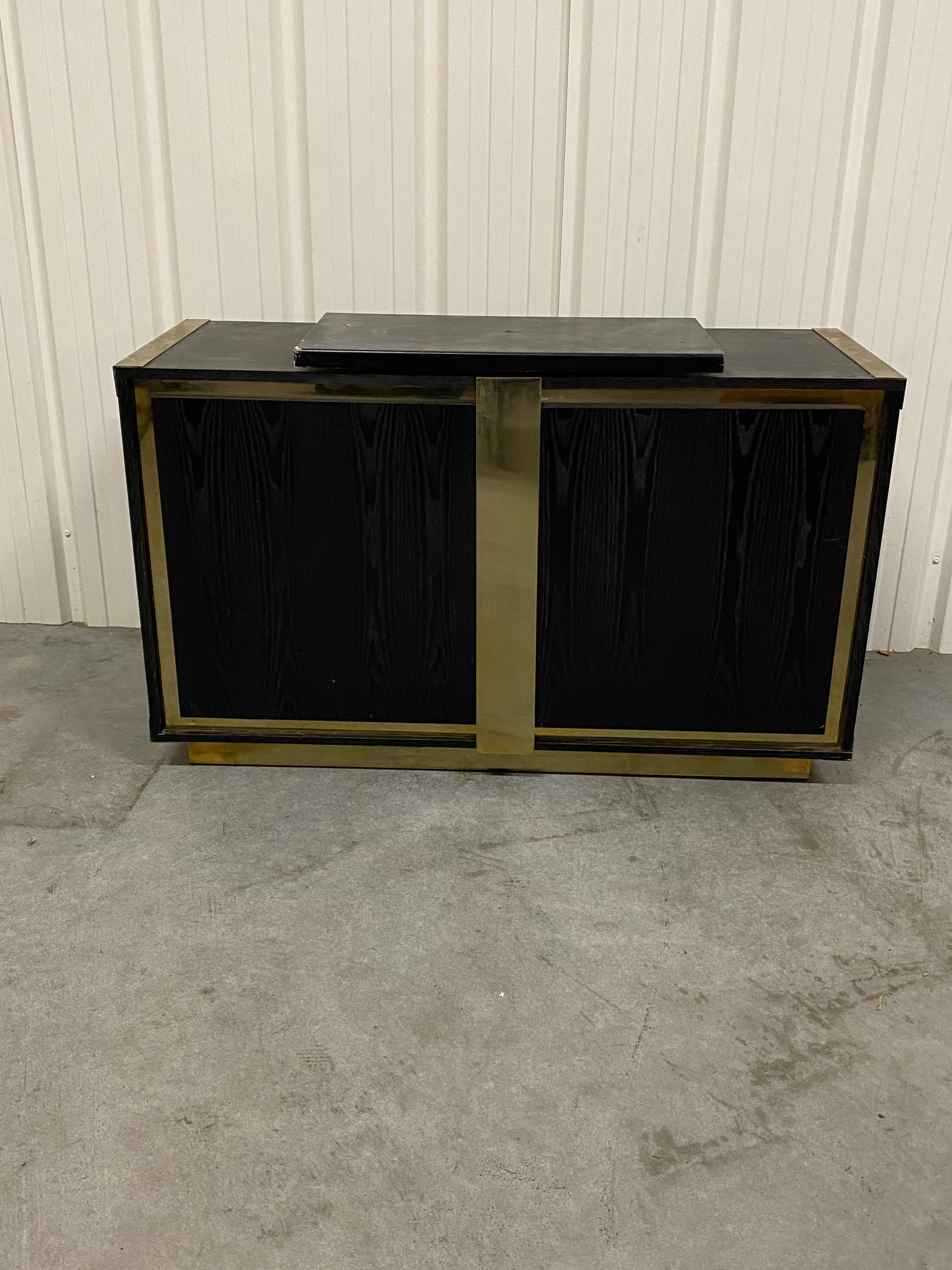 Mid-Century Modern Small sideboard in blackened oak and brass circa 1970  For Sale