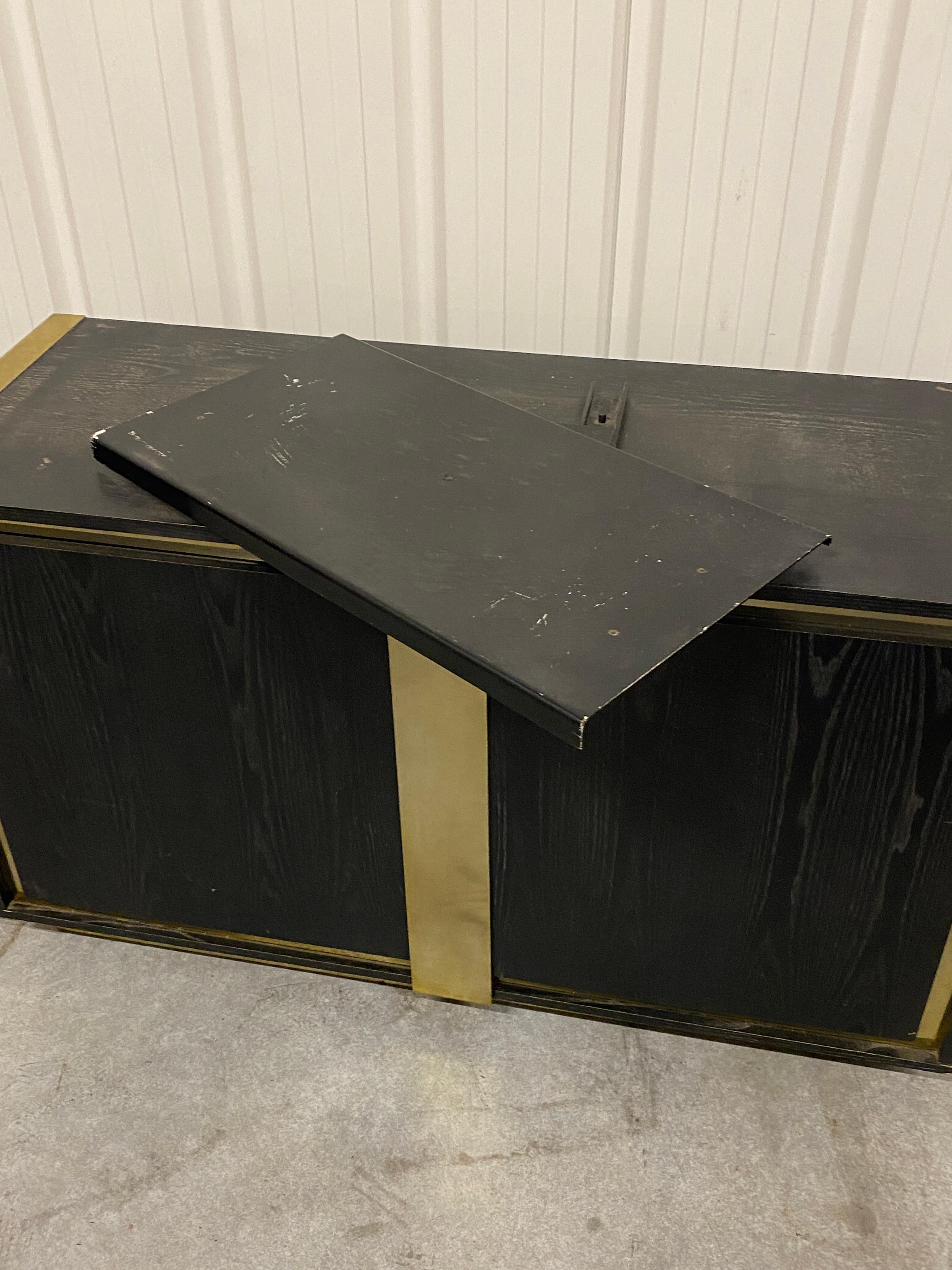 Metal Small sideboard in blackened oak and brass circa 1970  For Sale