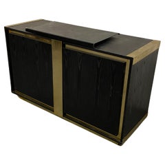 Small sideboard in blackened oak and brass circa 1970 