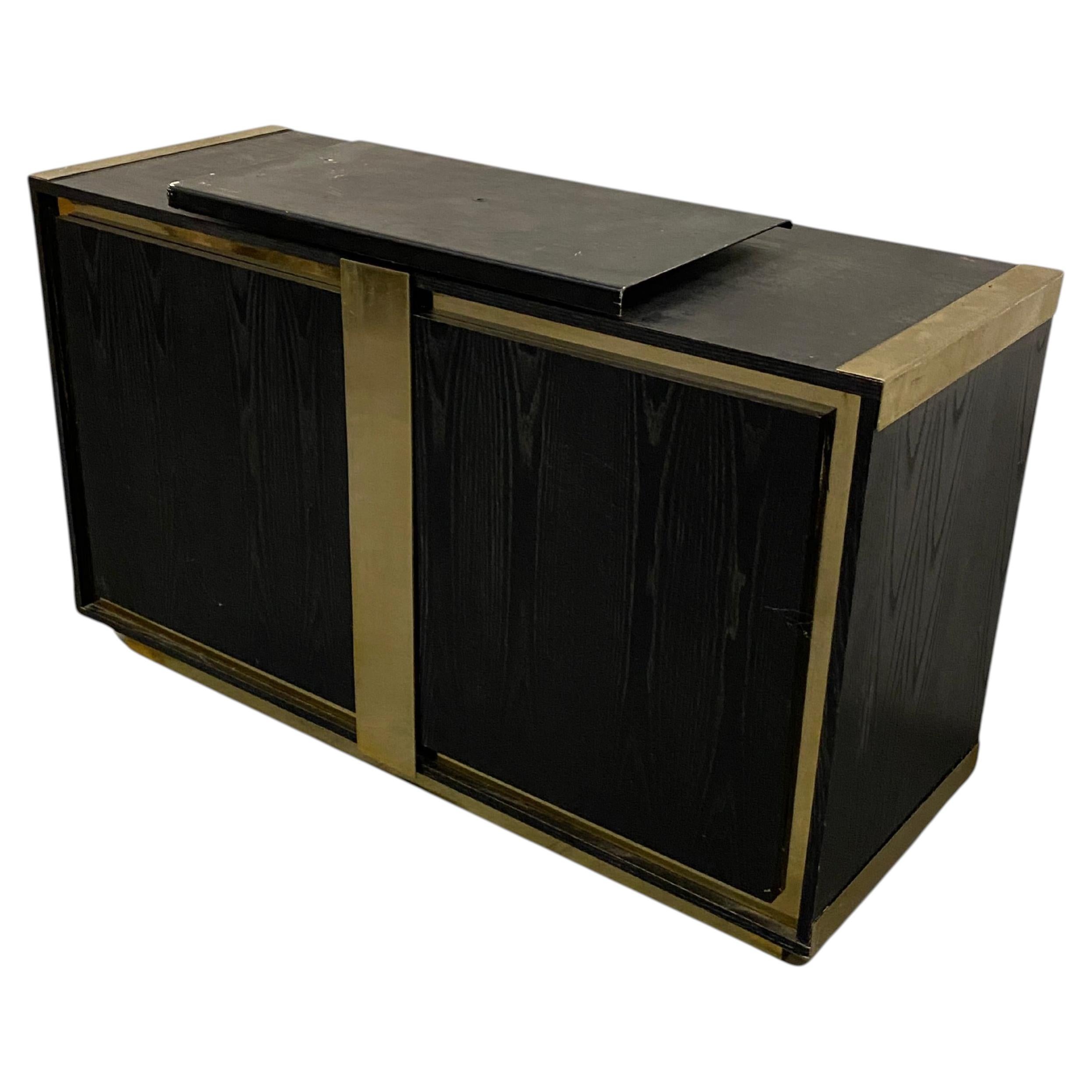 Small sideboard in blackened oak and brass circa 1970 For Sale