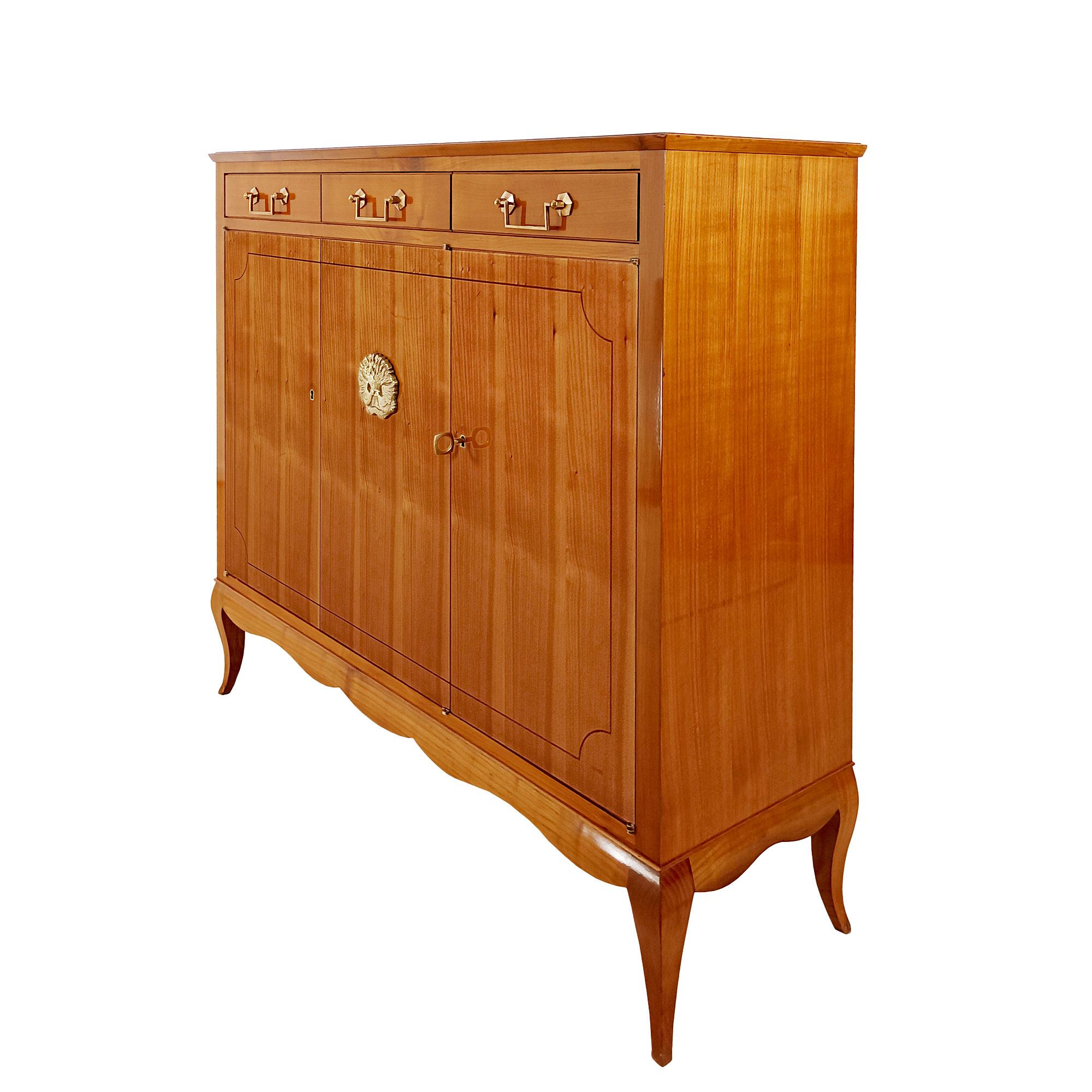 Small sideboard or cabinet in solid wood (oak and cherry) and cherry veneer, fine mahogany rods on the doors, polished bronze “doves” medallion on the central door, polished brass handles and hardware. Very high quality of craftsmanship. French