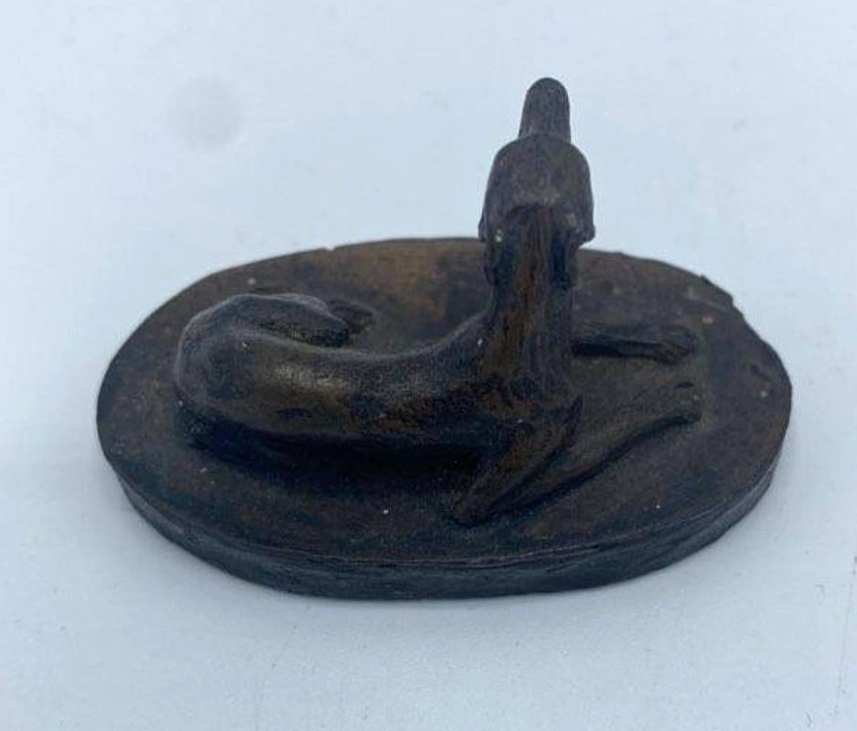 Small Signed Early 20th century Bronze of Reclining Whippet dog
Signature located on back of dog, unable to read artist's name
Measures: 1.5