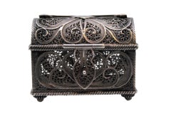 Small silver filigree jewelry box in the shape of a chest w/ clasp & hinged lid