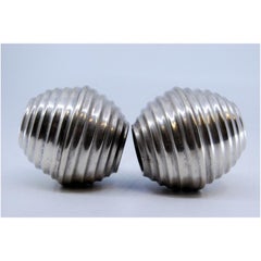 Small silver jars in circular shapes