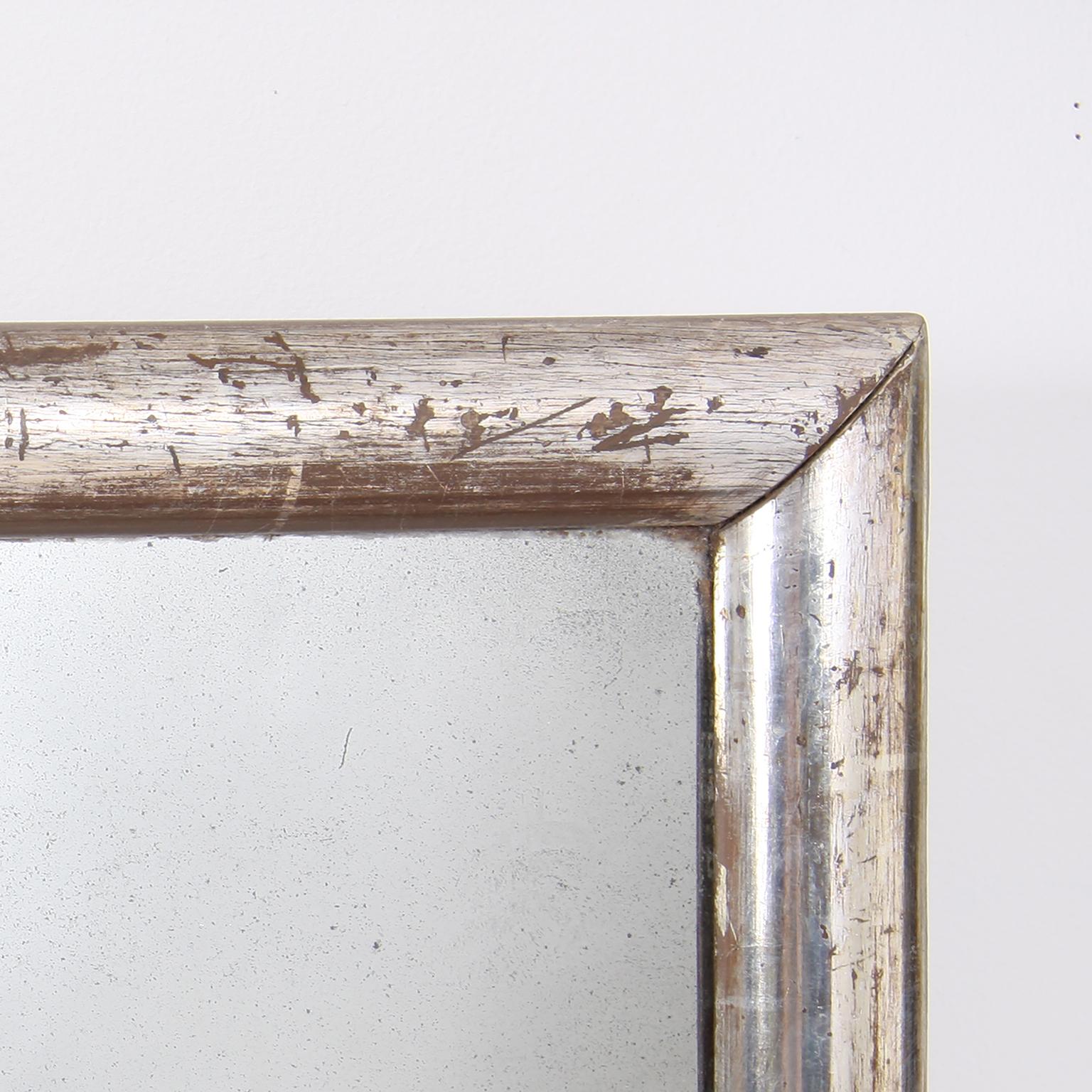 Lovely small silver leaf, 19th century mirror. It features the original glass and has gorgeous gilding.