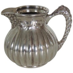 Small Silver Plated Pitcher with Twisted Handle and Floral Pattern