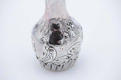 Small silver vase with embossed flowers